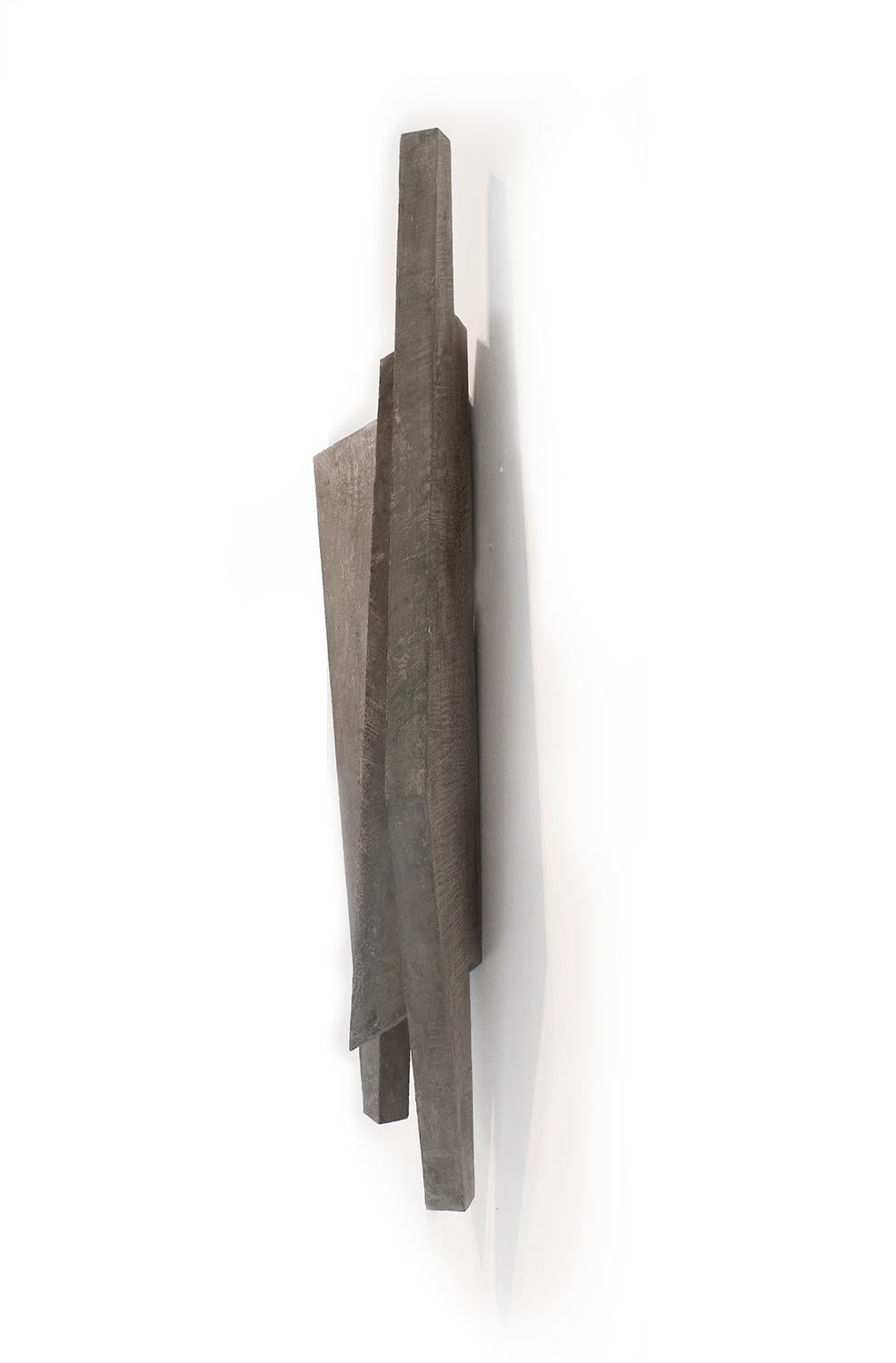 Minimalist three dimensional wall sculpture in slate grey 
