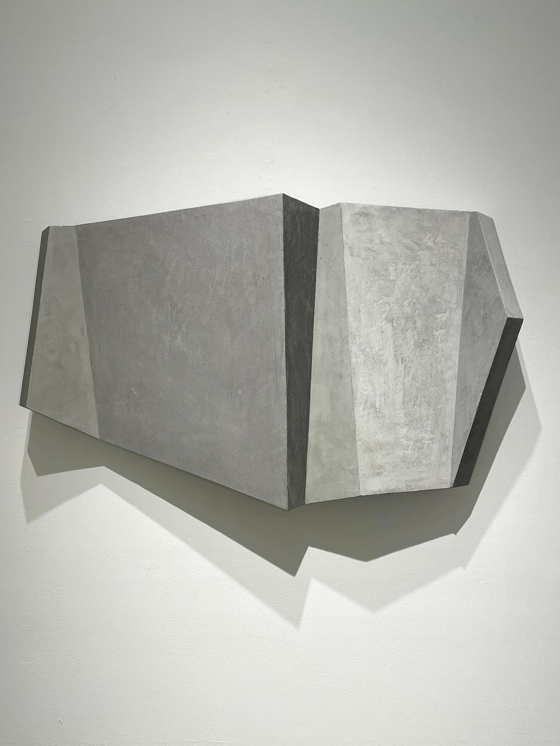 Abstract geometric, minimalist, three dimensional wall sculpture in light grey  
Precision board, Venetian Plaster, pigments, and beeswax
Despite it's stone-like appearance, the sculpture weighs about 3 pounds and hangs flush to the wall with a