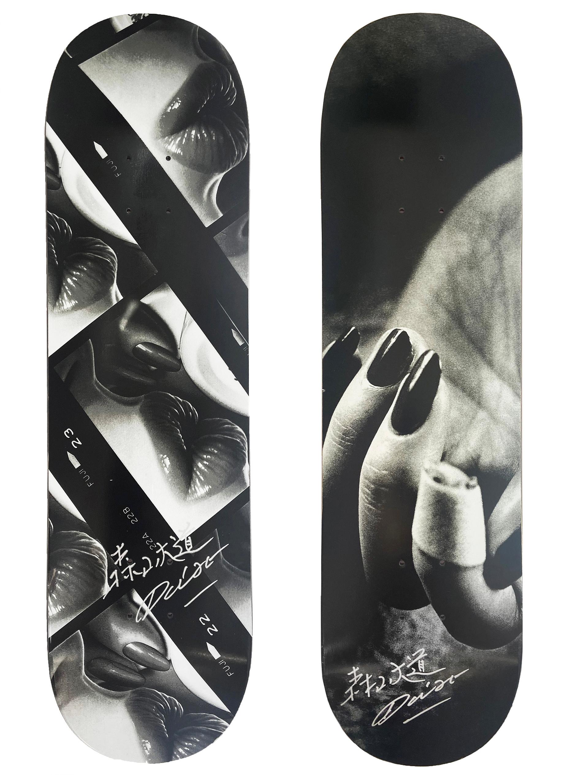 Hand-signed Daido Moriyama Skateboard decks: set of 2 individual works:
These works originated as a result of the collaboration between the legendary Japanese street photographer Daido Moriyama & Evisen Skateboards. The decks feature Moriyama's