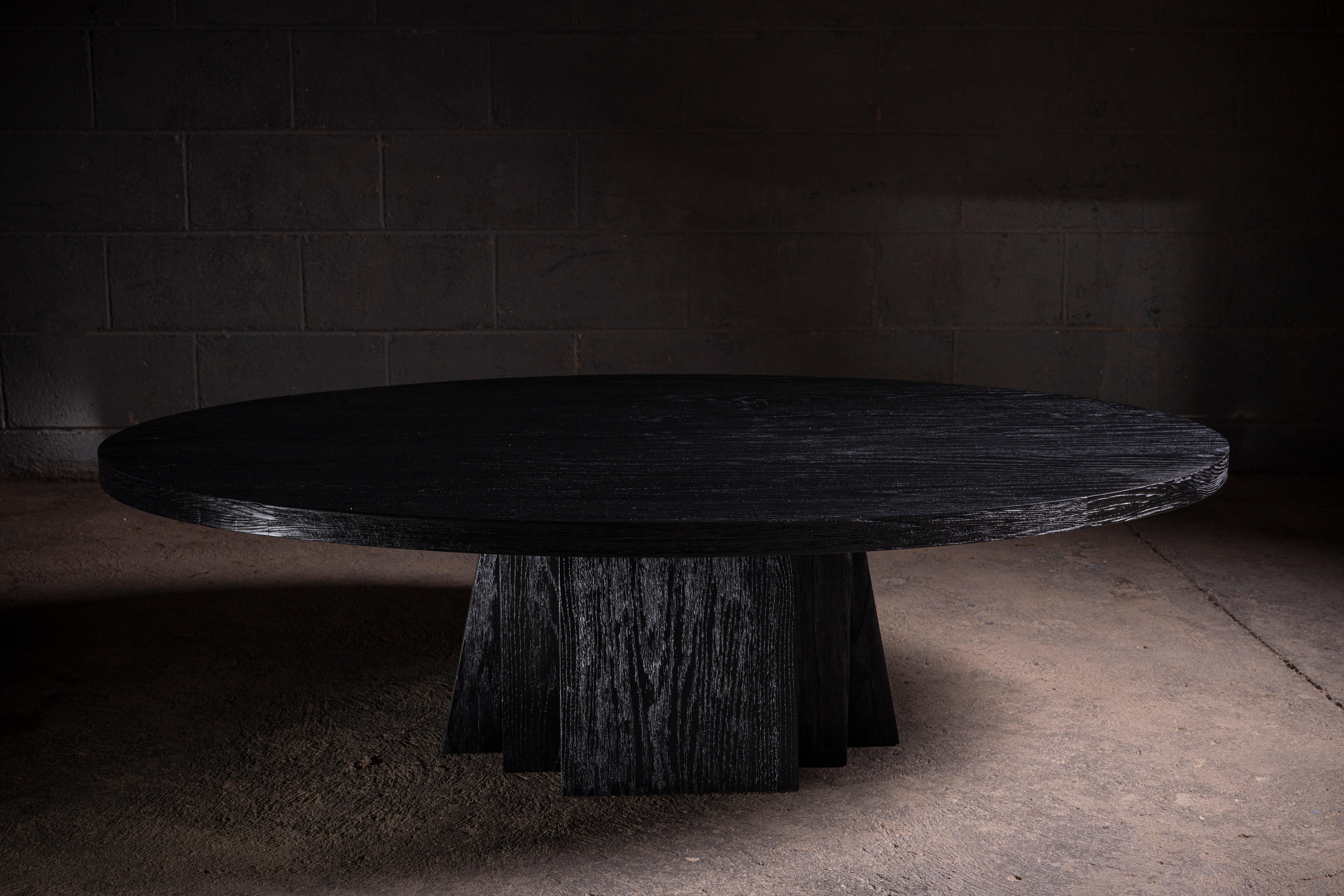Oval Solid Black Oak Coffee Table with a Geometrical Base, Inspired in Brutalist Architecture.