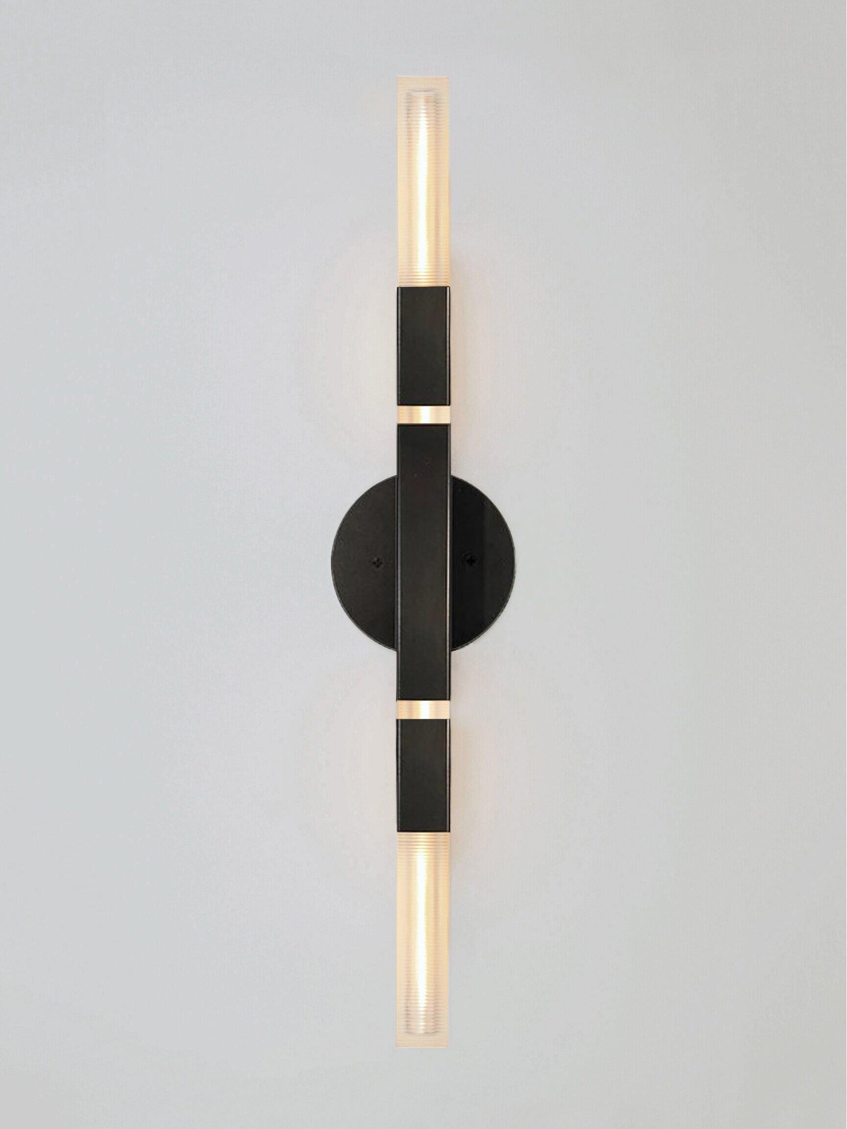 Daikon Studio  POST  Banded Duo Sconce 

The Banded Duo Sconce celebrates the poetic dialogue between light and form to create a fixture that leans into the timeless and iconic. Meticulously crafted by hand in our studios. Horizontal or vertical