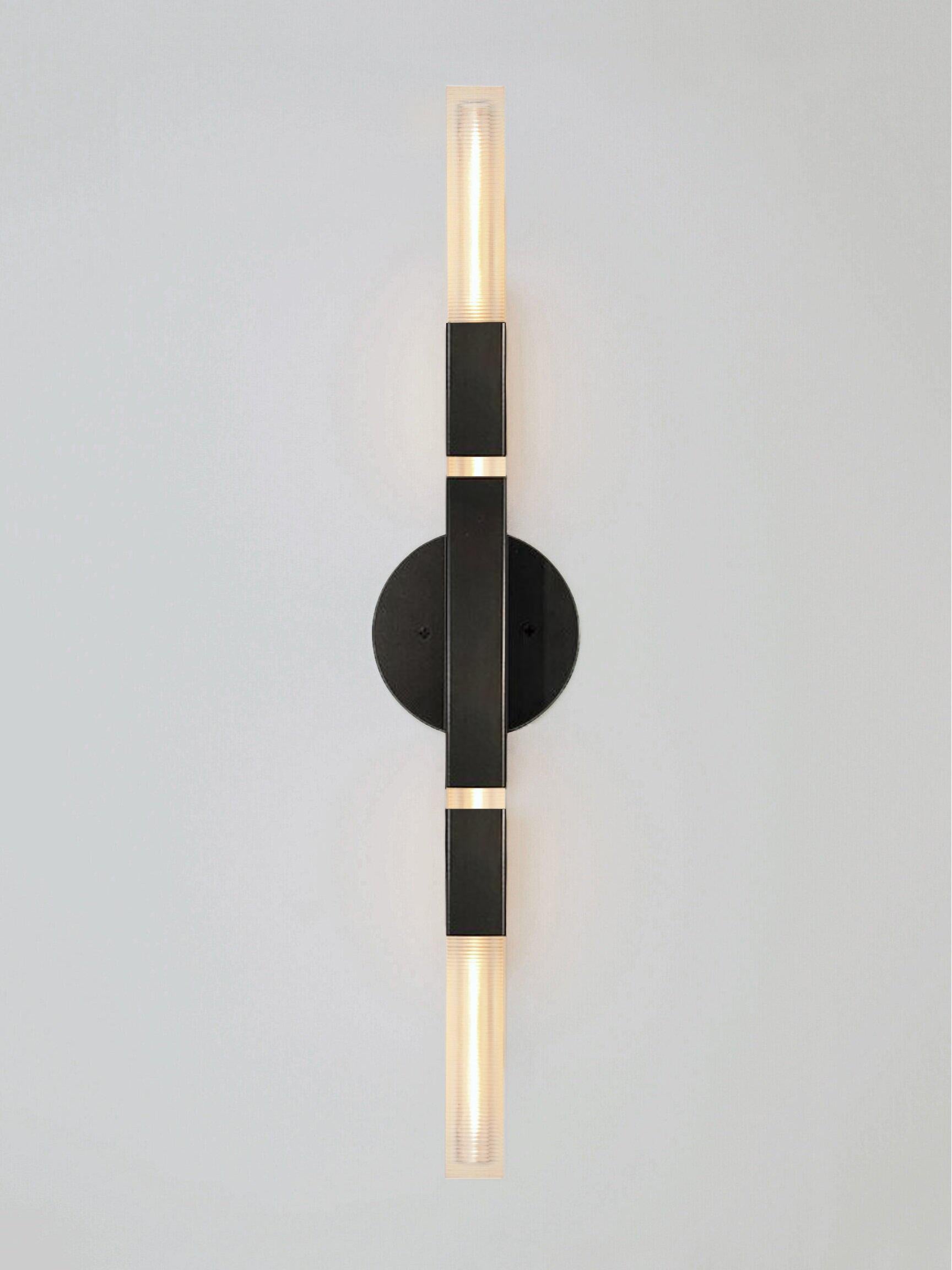 Daikon Studio  POST  Banded Duo Sconce 

The Banded Duo Sconce celebrates the poetic dialogue between light and form to create a fixture that leans into the timeless and iconic. Meticulously crafted by hand in our studios. Horizontal or vertical