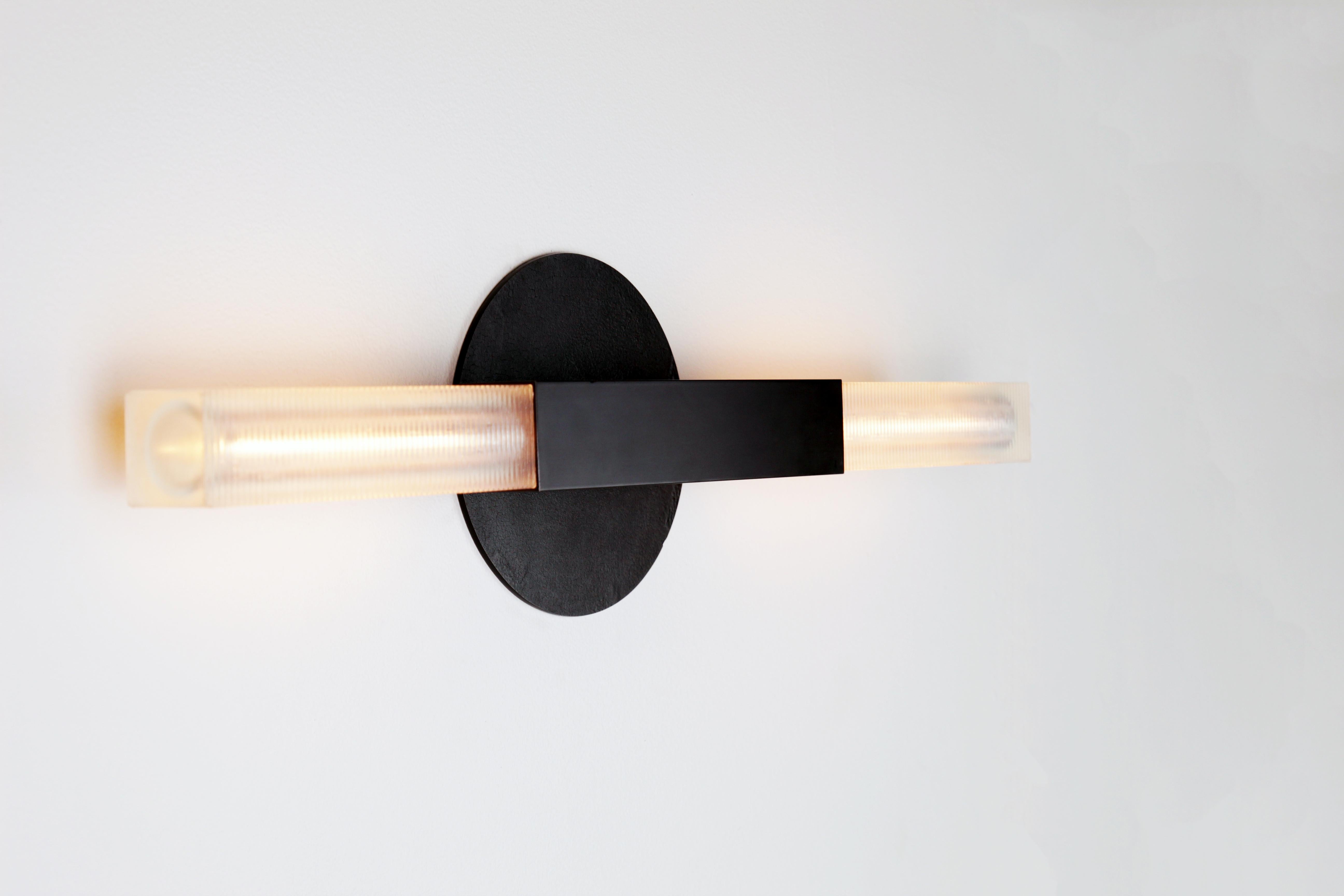 black and brass sconces