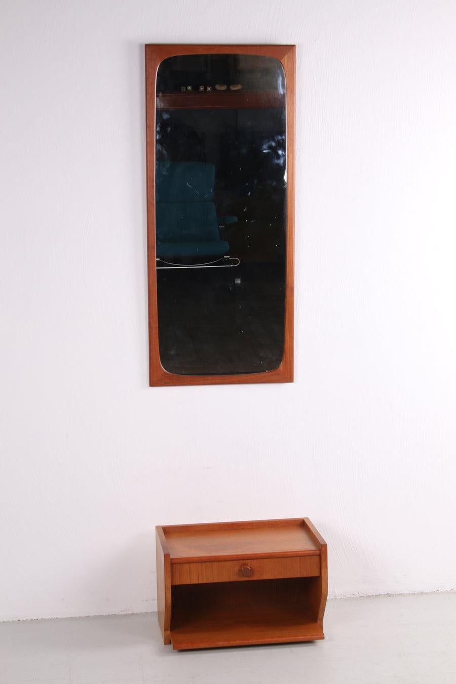 Teak Wooden Hallway Set Mirror with Floating Dresser, 1960
Condition: In good condition
Beautiful unique set for on the wall.
Sleek Danish teak mirror with special raised edge & stylish floating wall cabinet.
Period: 1960s.
Country of origin :