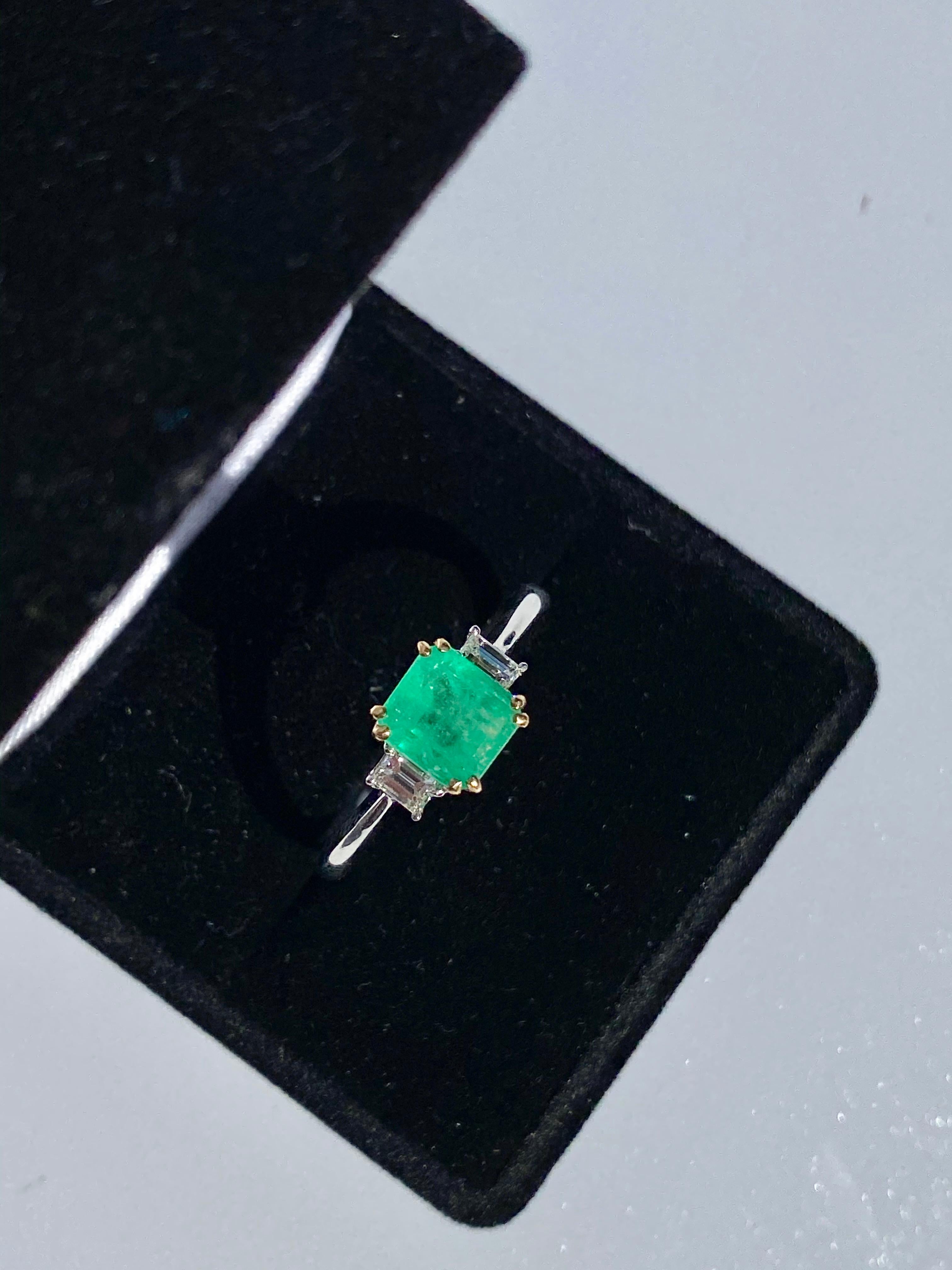 Centering a 1.20 Carat Emerald-Cut Colombian Emerald, shouldered by four Baguette-Cut Diamonds totaling 0.24 Carats, and set in 18K White Gold, this Colombian beauty rests upon a modern classic.

Details:
✔ Stone: Emerald
✔ Stone Weight: 1.20