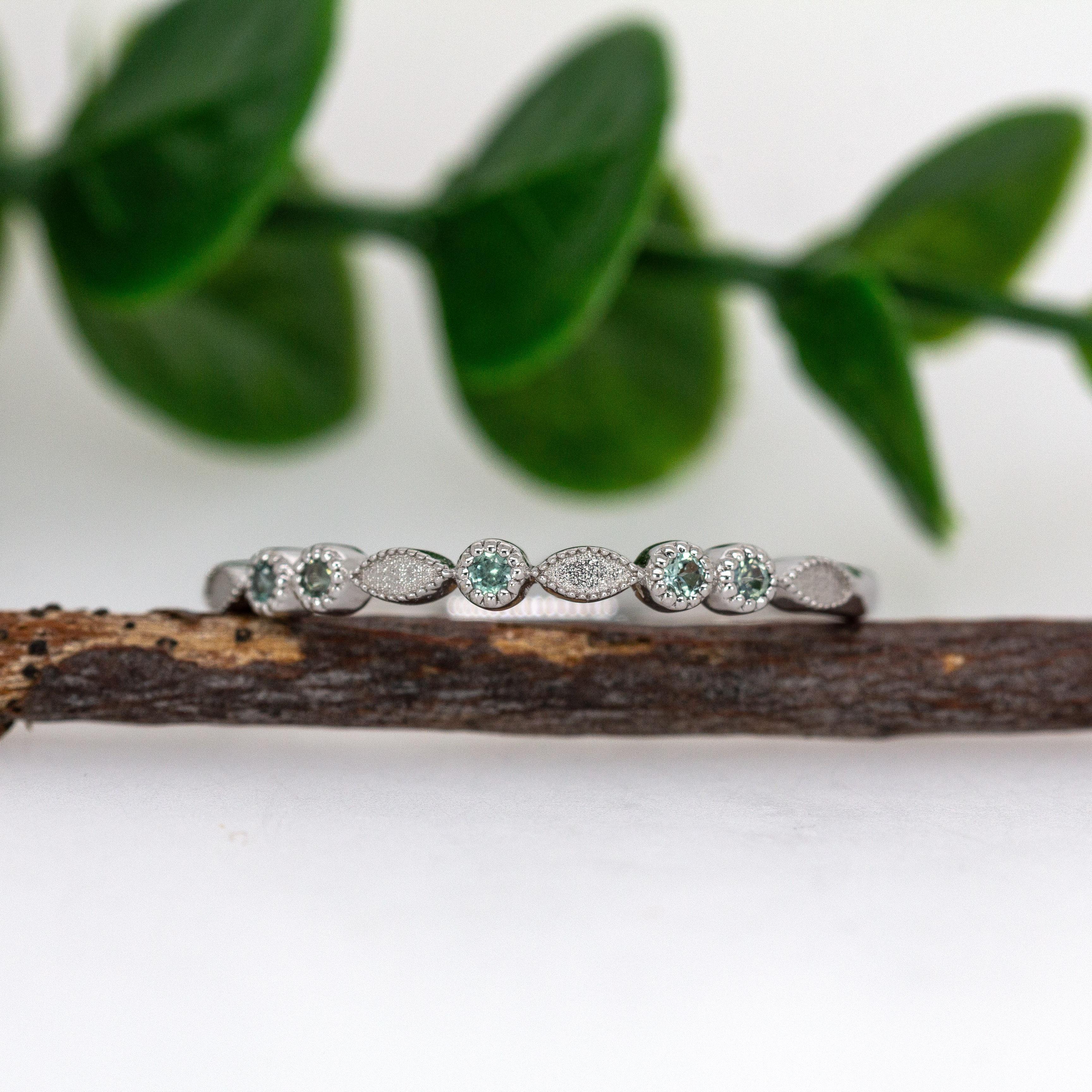A dainty alexandrite band in solid 14k real white gold, finished with fine milgrain edging. Stackable and elegant, with subtle antique-inspired texture and a stone that shifts color in different light.

Specifications:

Item Type: Ring
Center