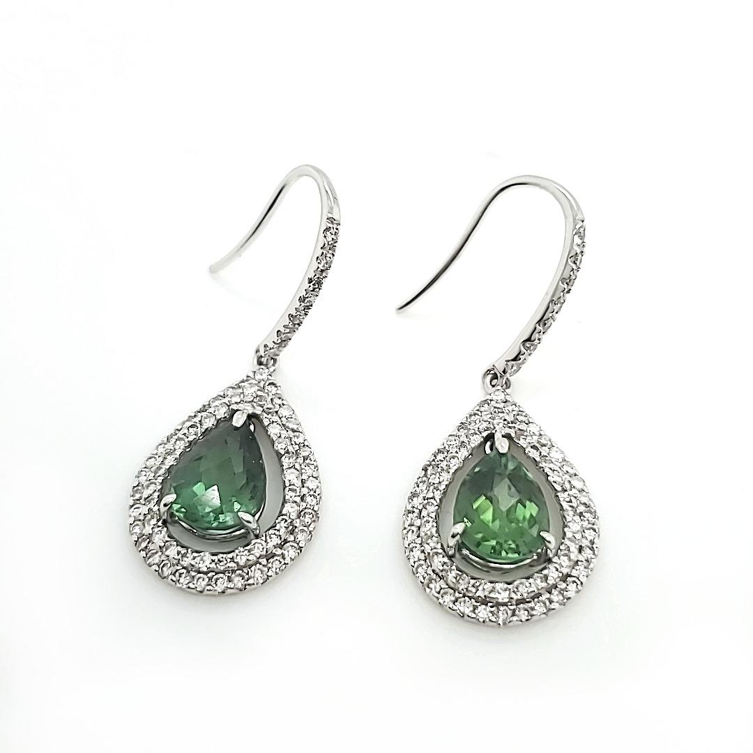EJ807 

Dainty and attractive Green Amethyst and Diamond earrings 

Splendid for everyday wear and and those casual afternoons and evenings. 

The hue of this green evokes a feeling of spirit and liberalism and let's one feelings flow like the wind