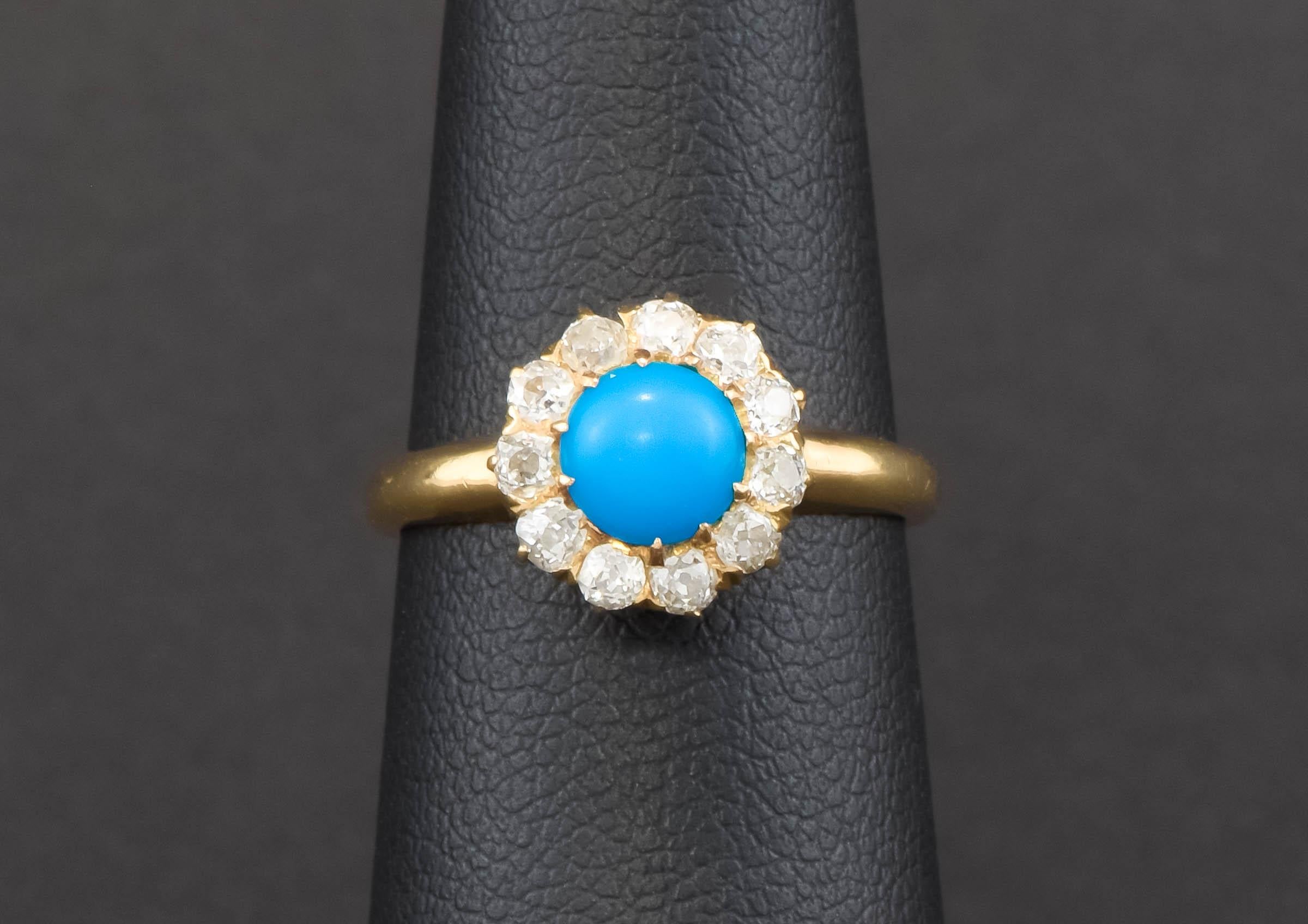 I’m pleased to offer a lovely, dainty and sparkly Victorian Persian Turquoise Diamond ring found in a New England estate.

Finely crafted of 14K yellow gold, the ring features a vividly colored turquoise cabochon surrounded by a diamond halo