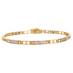 Armband aus 18 Karat Gelbgold mit zarten Baguetteschliff-Diamanten 