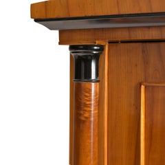 Dainty column-style cabinet with Schinkel-style pediment Biedermeier, cherrywood