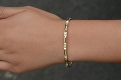 0.20ctw Diamond and 14k Gold Bangle Bracelet