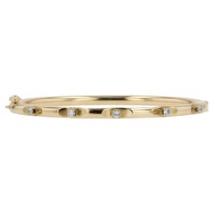 0.20ctw Diamond and 14k Gold Bangle Bracelet