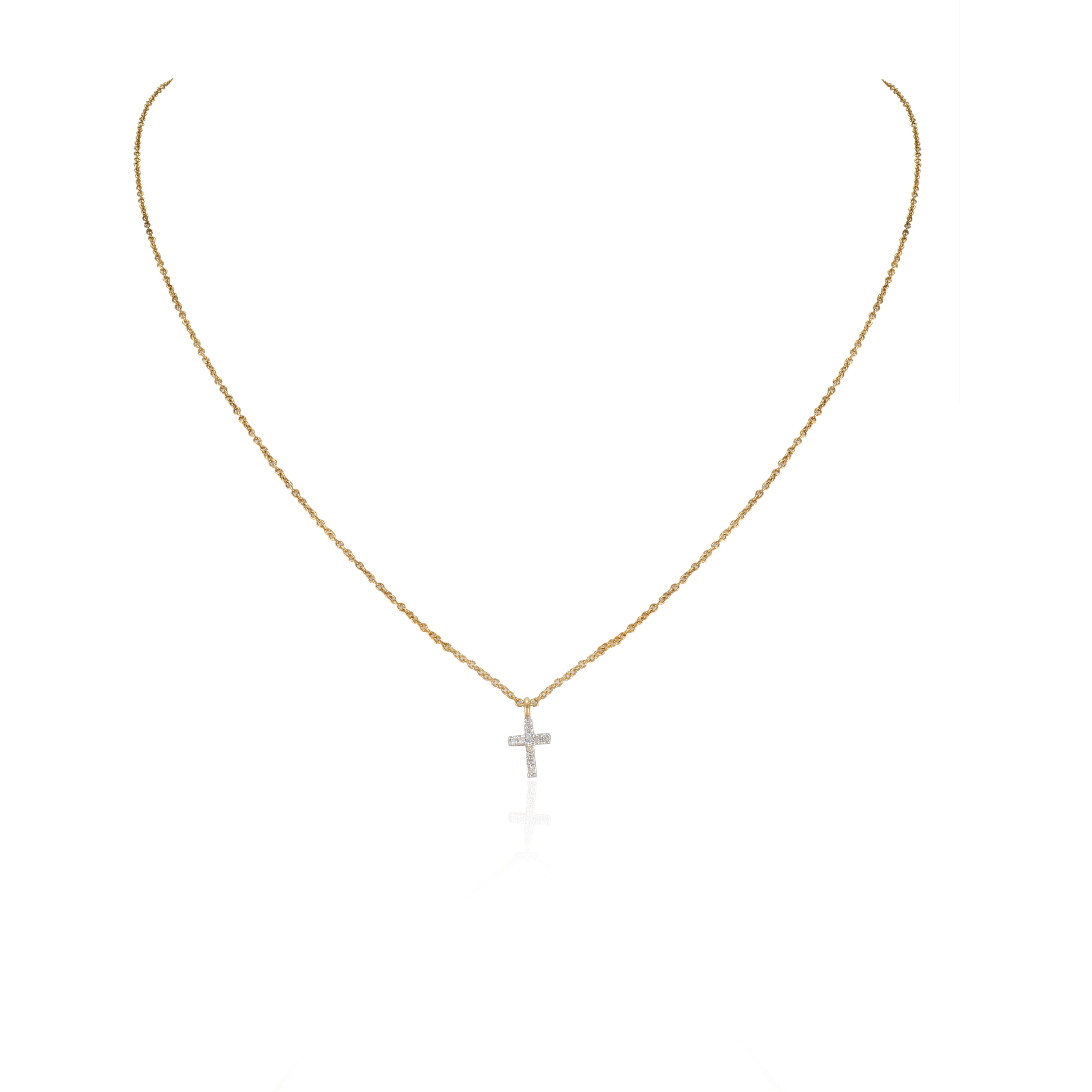 Dainty Diamond Studded Cross Pendant Necklace with Chain in 18K Gold studded with round cut diamonds. This stunning piece of jewelry instantly elevates a casual look or dressy outfit. 
April birthstone diamond brings love, fame, success and