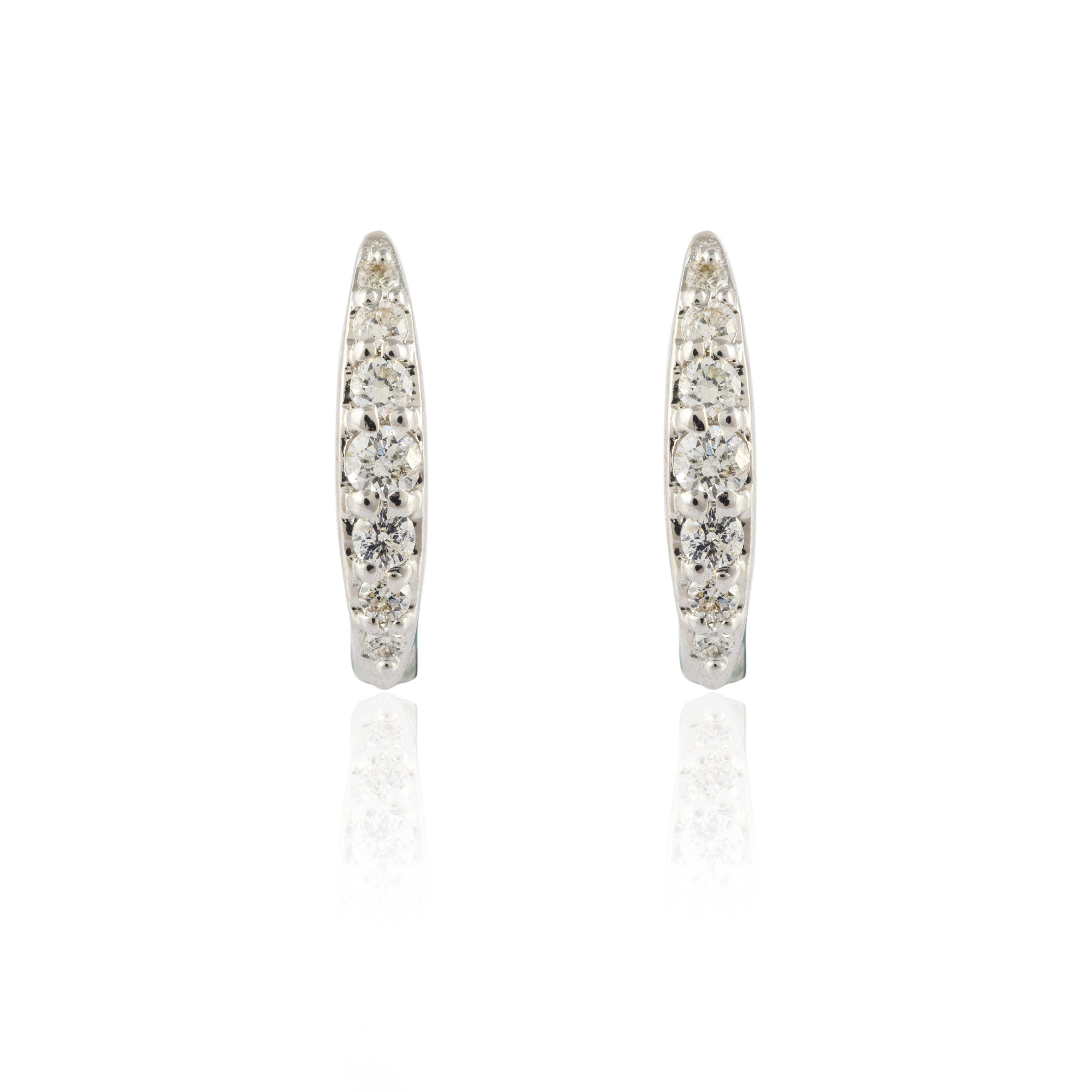 Dainty Diamond Huggie Earrings in 18K Gold to make a statement with your look. You shall need huggie earrings to make a statement with your look. These earrings create a sparkling, luxurious look featuring round cut diamonds.
April birthstone