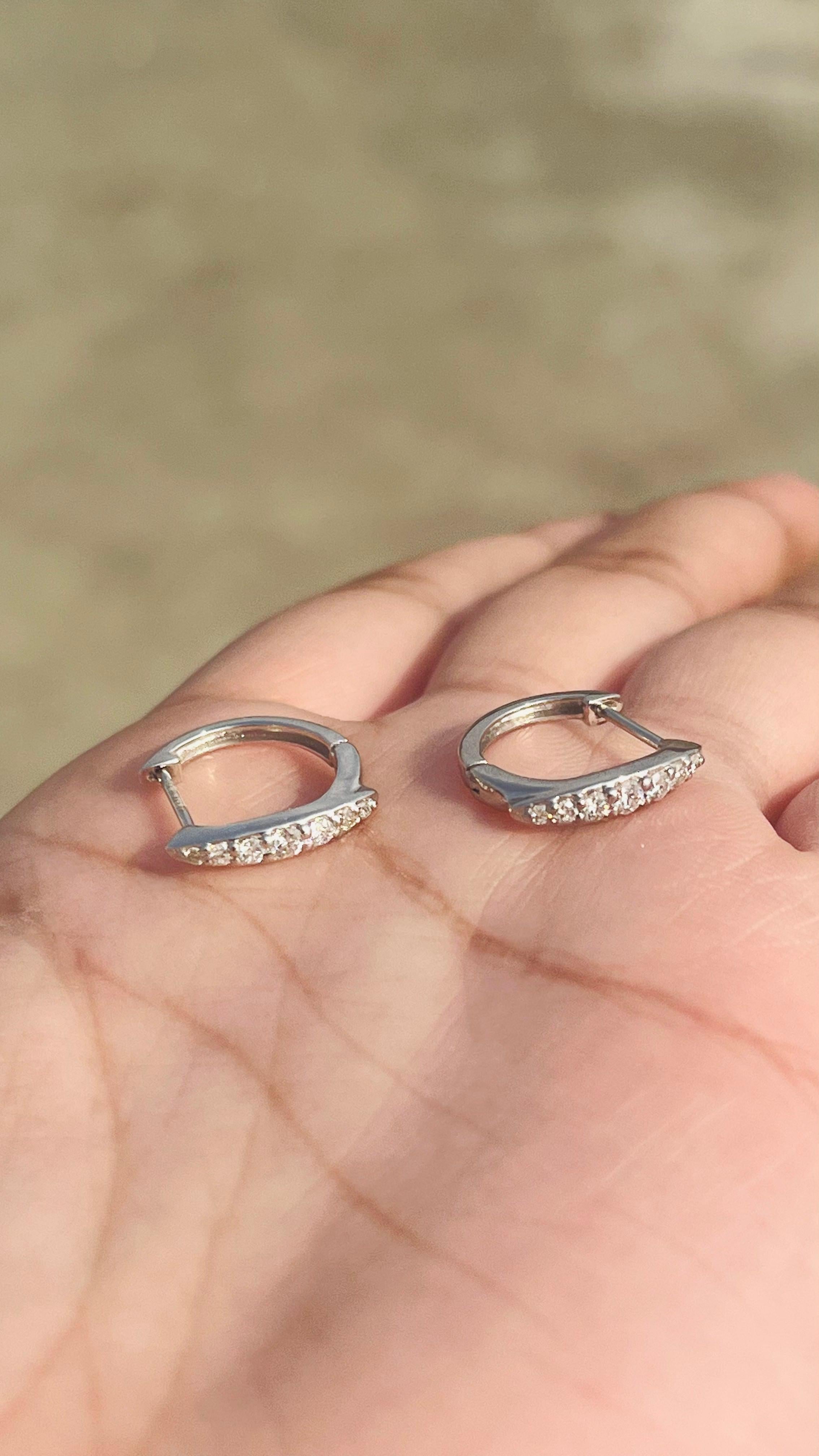 Dainty Diamond Huggie Earrings Set in 18kt Solid White Gold with Shared Prongs In New Condition For Sale In New York, NY