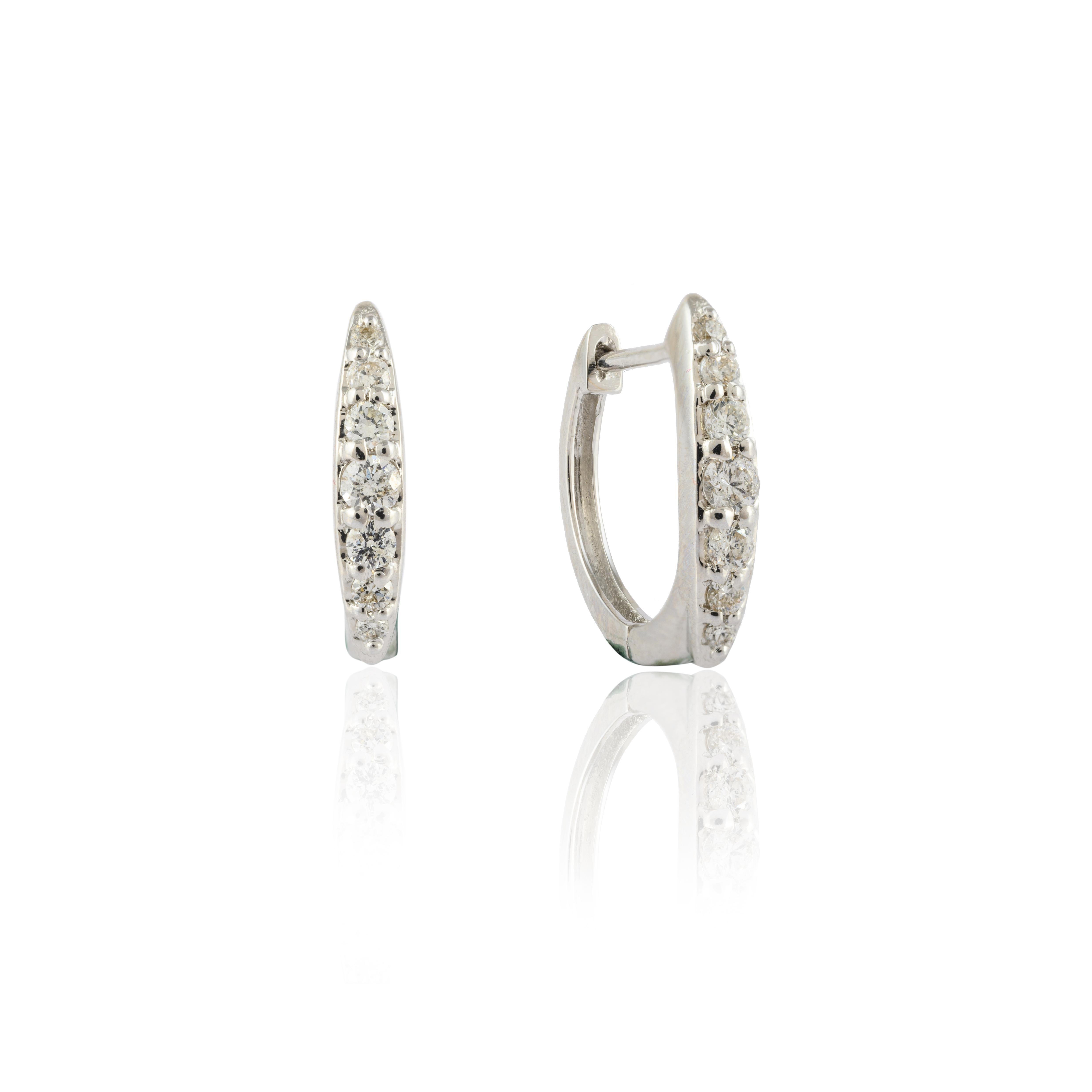Women's Dainty Diamond Huggie Earrings Set in 18kt Solid White Gold with Shared Prongs  For Sale