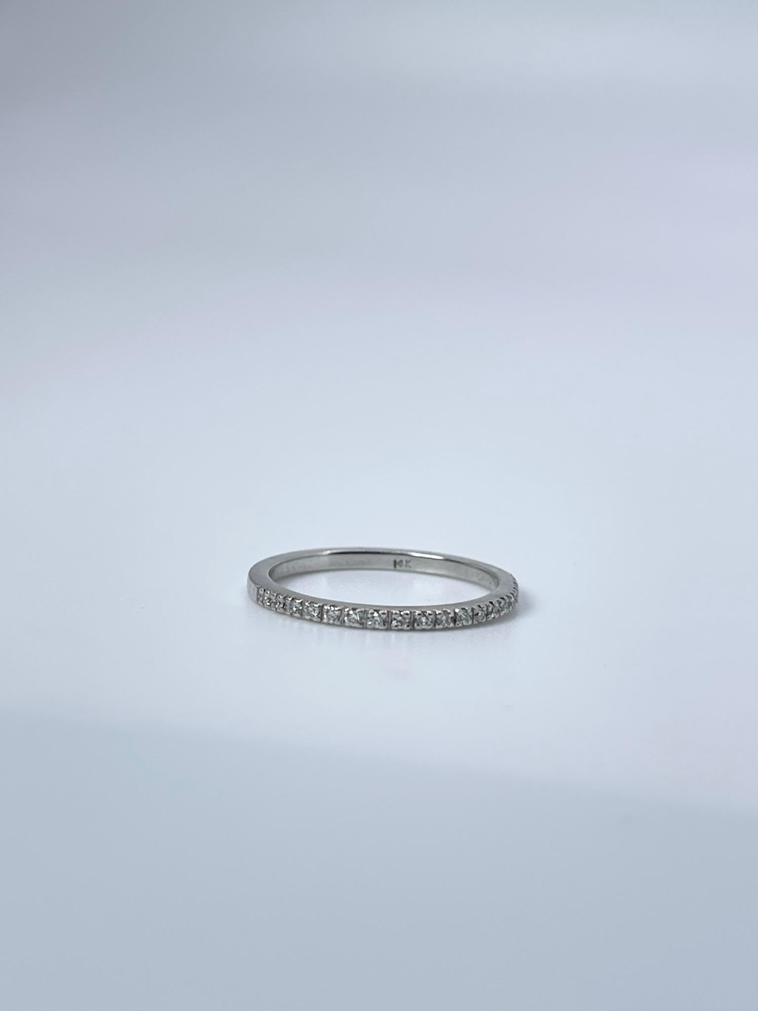 Micro Pave ring in 14KT white gold with natural round brilliant diamonds.
ITEM#: RF 110-00040
GRAM WEIGHT: 1.22gr
METAL: 14KT

NATURAL DIAMOND(S)
Cut: Round Brilliant
Color: G
Clarity: SI 
Carat: 0.11ct
Size: 5 ( can be re-sized)


WHAT YOU GET AT