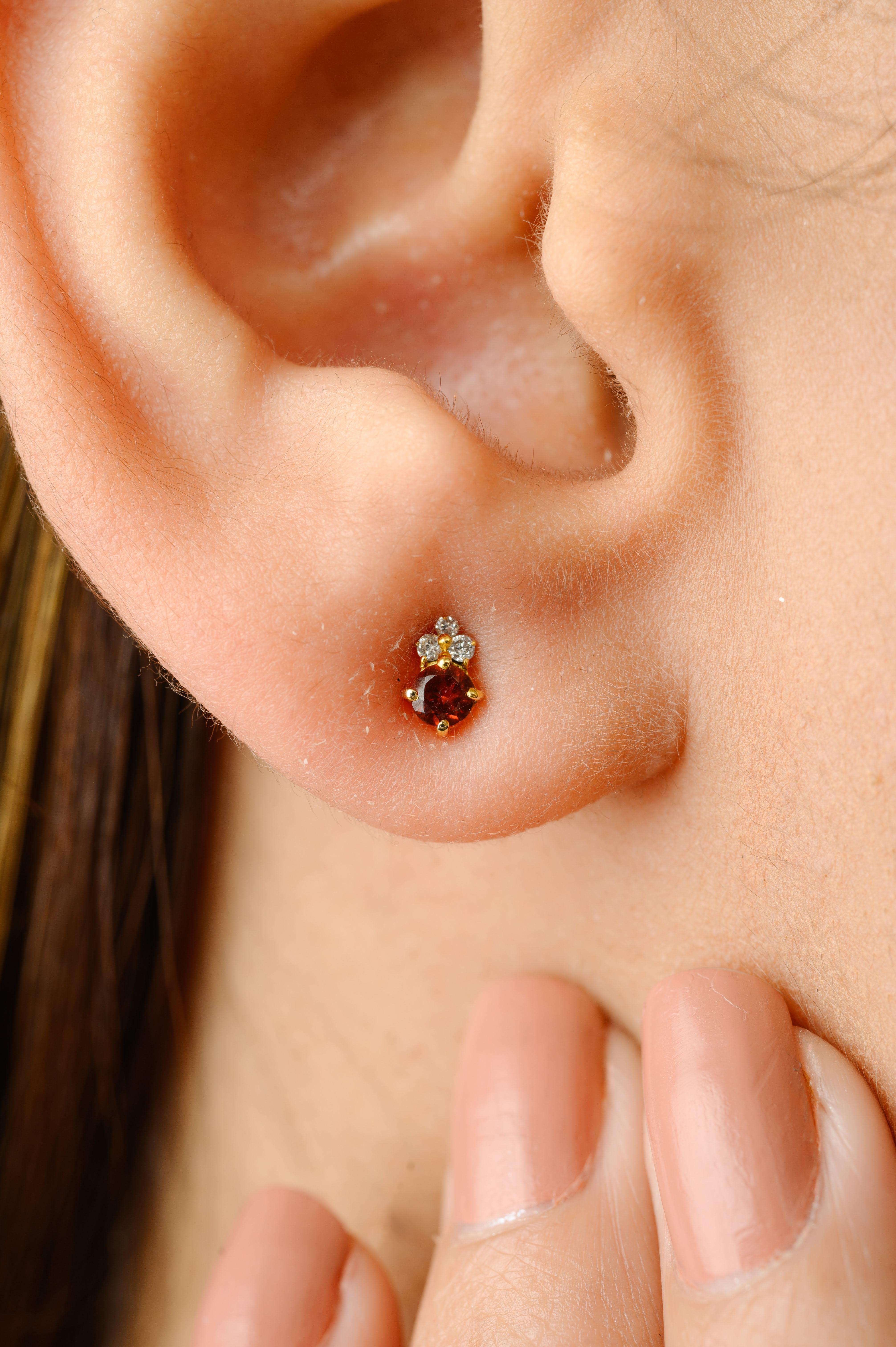 Dainty Garnet and Diamond Pushback Stud Earrings in 14K Gold to make a statement with your look. You shall need stud earrings to make a statement with your look. These earrings create a sparkling, luxurious look featuring round cut garnet.
Garnet