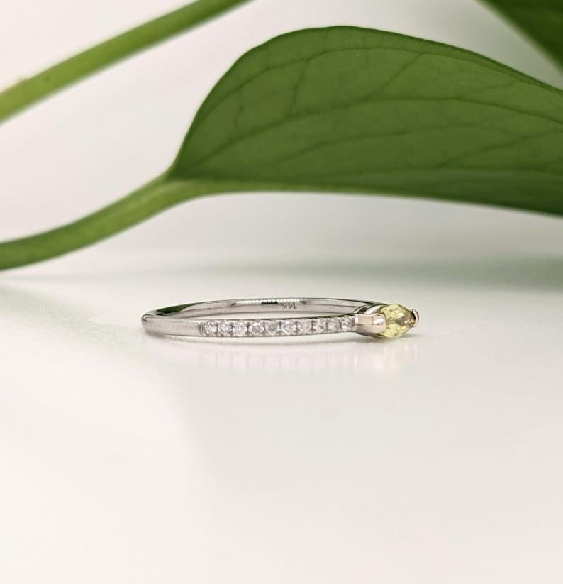 This dainty inspired ring features a stunning vibrant green yellow colored sapphire in 14K yellow gold with diamond accents. This staple ring makes for a stunning accessory to any look!

A fancy ring design perfect for an eye catching engagement or