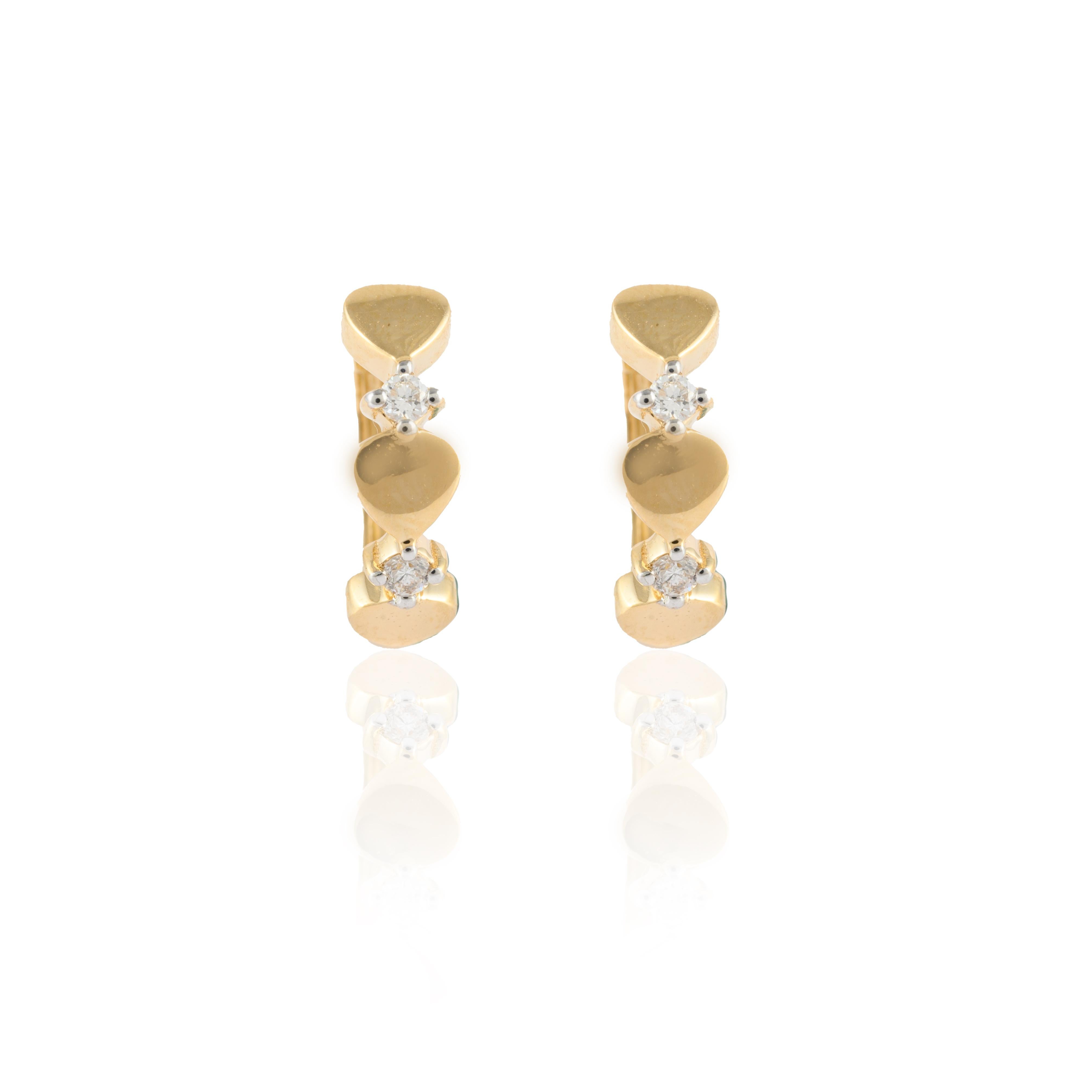 Dainty Love Heart Diamond Huggie Earrings in 14K Gold to make a statement with your look. You shall need huggie earrings to make a statement with your look. These earrings create a sparkling, luxurious look featuring round cut diamonds.
April