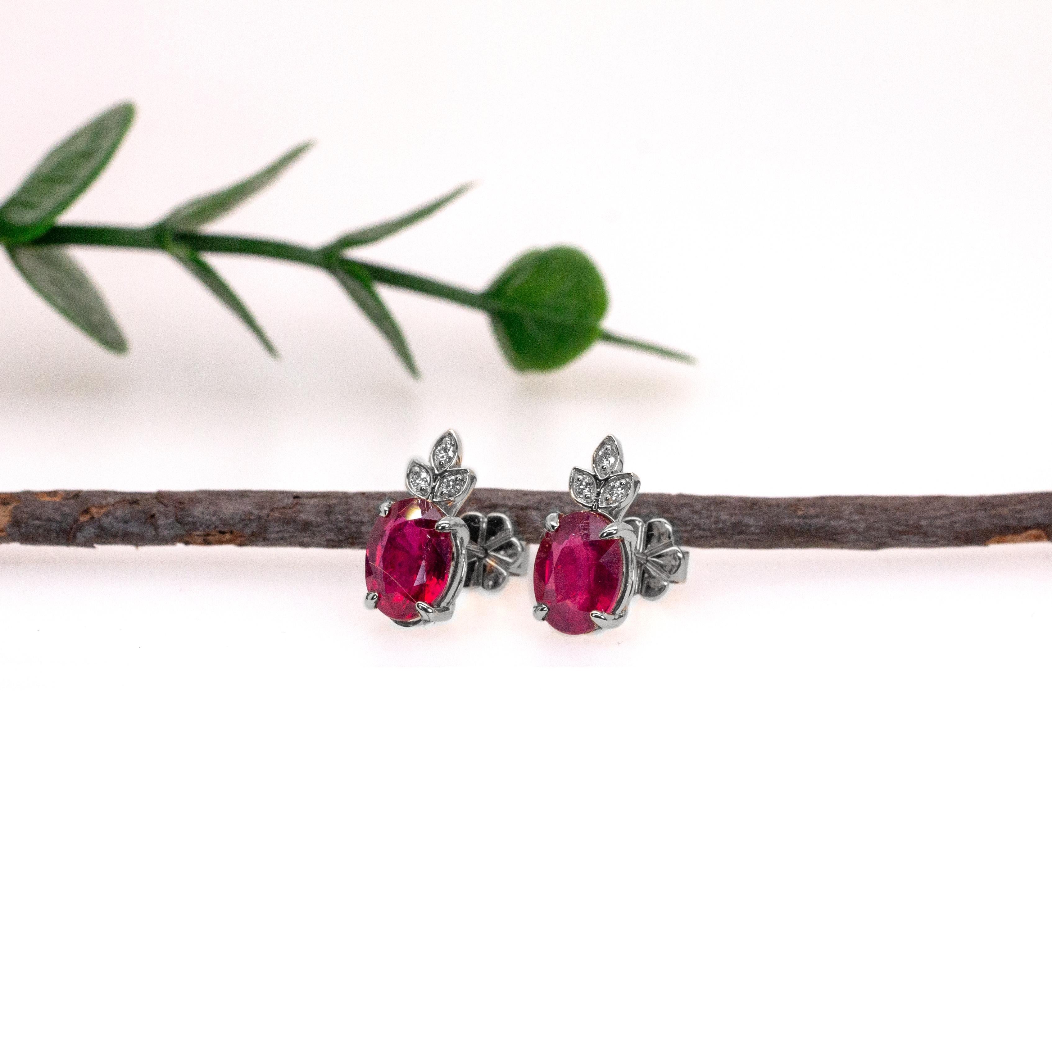 These dainty stud earrings feature a pair of 3.31 carat weight oval ruby gemstones with natural earth mined diamonds, all set in solid 14K gold. These earrings can be a beautiful July birthstone gift for your loved ones!

Specifications:

Item Type: