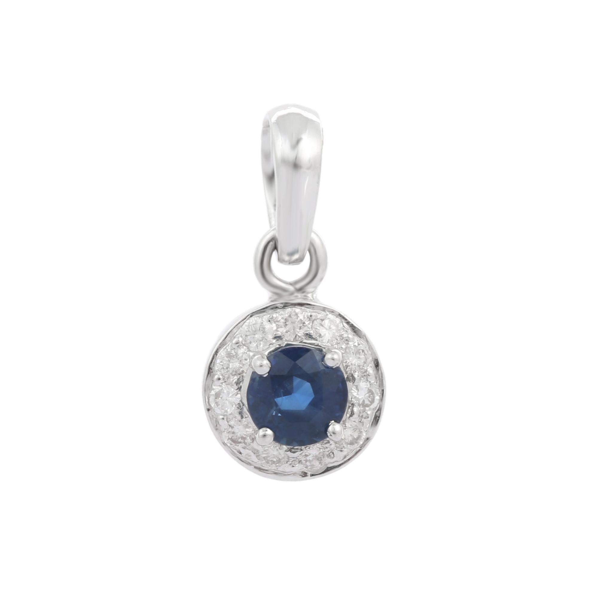 Natural Blue Sapphire pendant in 14K Gold. It has a round cut sapphire studded with diamonds that completes your look with a decent touch. Pendants are used to wear or gifted to represent love and promises. It's an attractive jewelry piece that goes