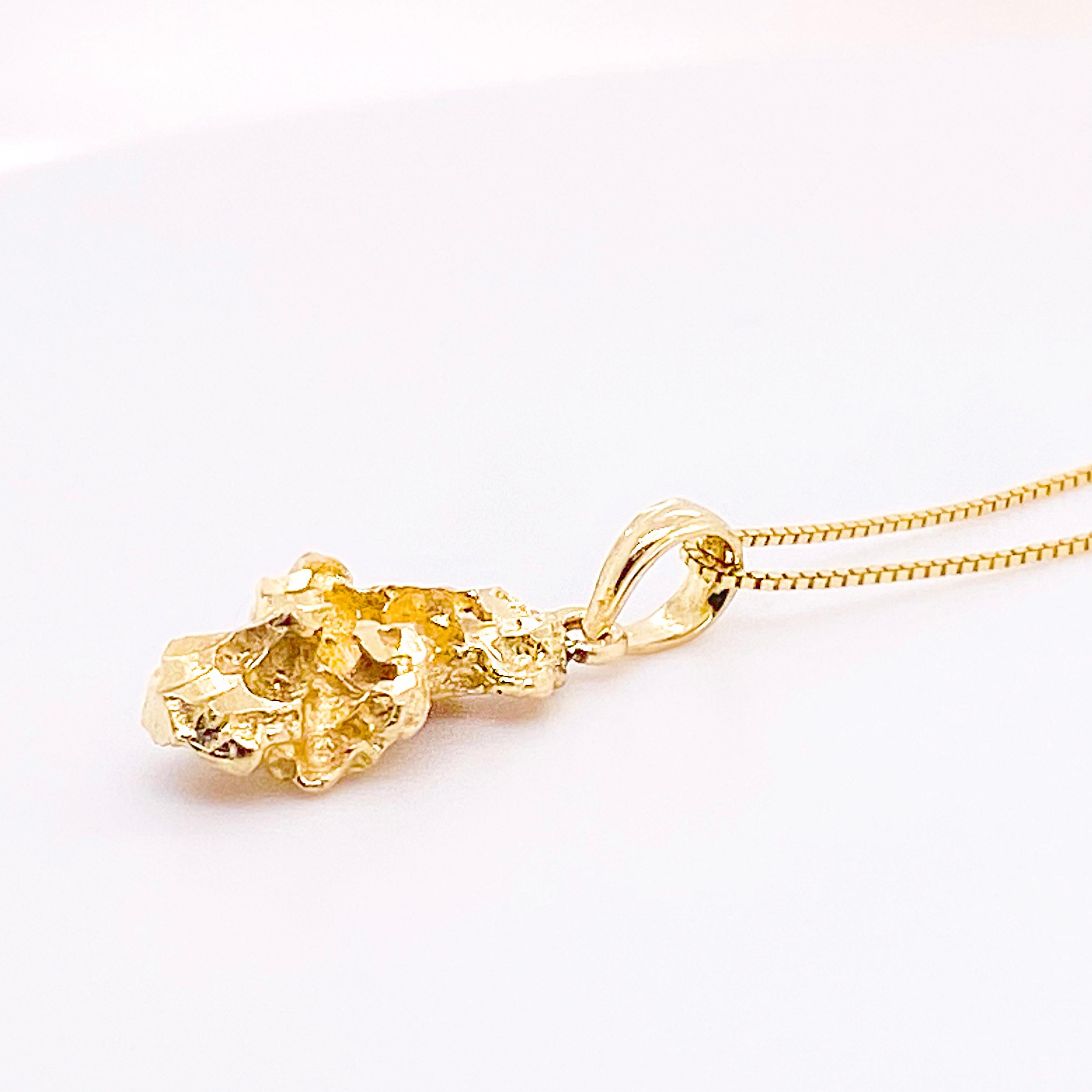 This 14 karat yellow gold diamond-cut nugget pendant is sparkly with mirror finishes in several places. Dainty in size, it will look great for an everyday pendant. The box chain is 14 karat yellow gold and measures 18 inches. The chain and pendant