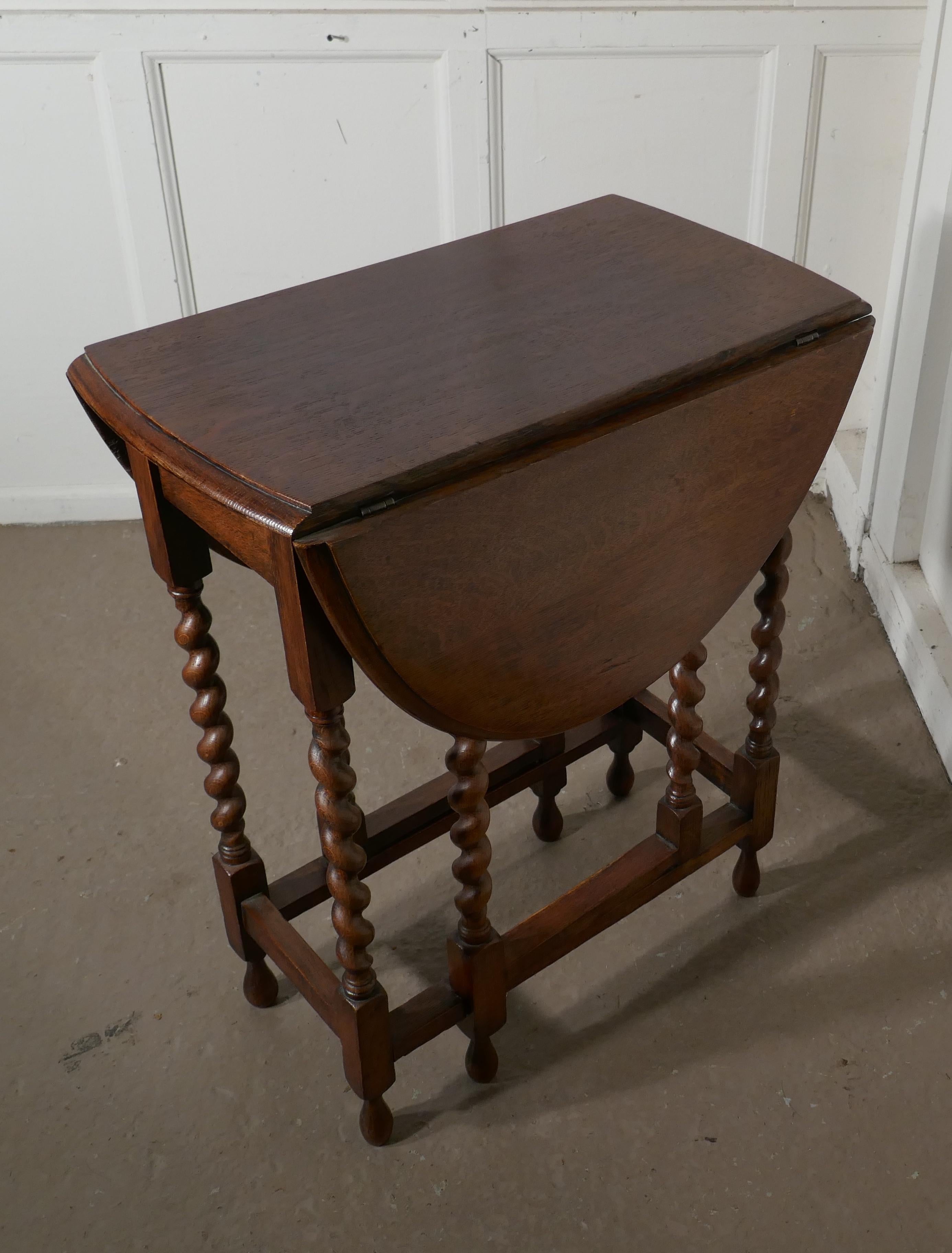 Dainty oak barley twist gate leg drop leaf occasional table

This is a very good quality solid oak small size gate leg table

The table is made from solid oak it has elegant crisply turned barley twist legs with oak cross members The table has a