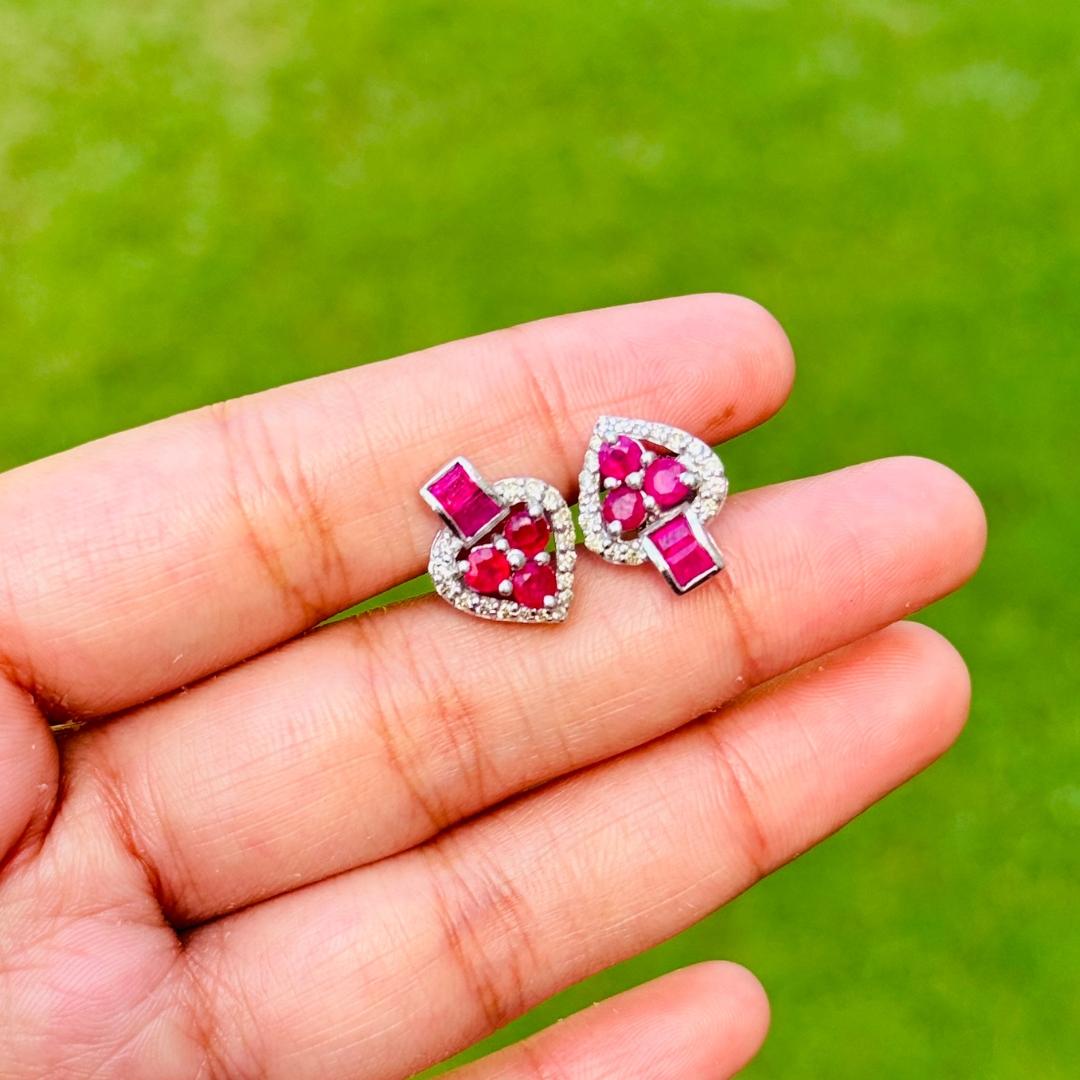 Dainty Ruby Diamond Heart Stud Earrings in sterling silver to make a statement with your look. You shall need stud earrings to make a statement with your look. These earrings create a sparkling, luxurious look featuring oval, baguette cut natural