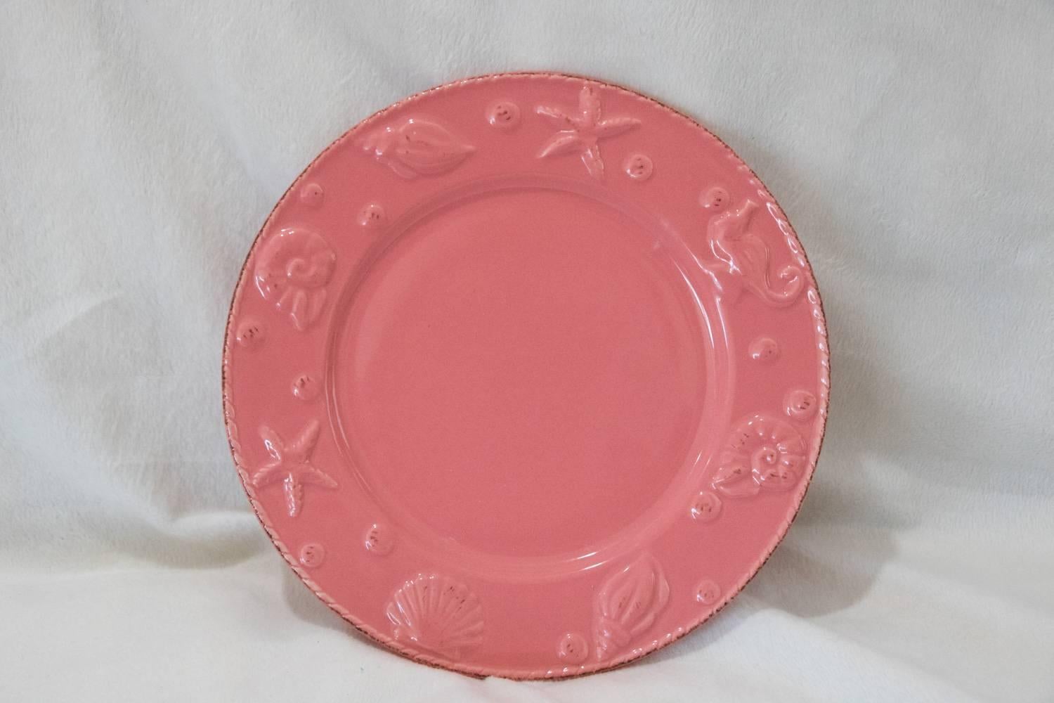 Dainty set of four punch pink seashell design lunch plates, add a pop of spring to any occasion. This set is a dainty addition to a mundane table setting. Perimeter has a variety of seashell designs.
Measure: Diameter: 8 inches, height 0.7 inches.