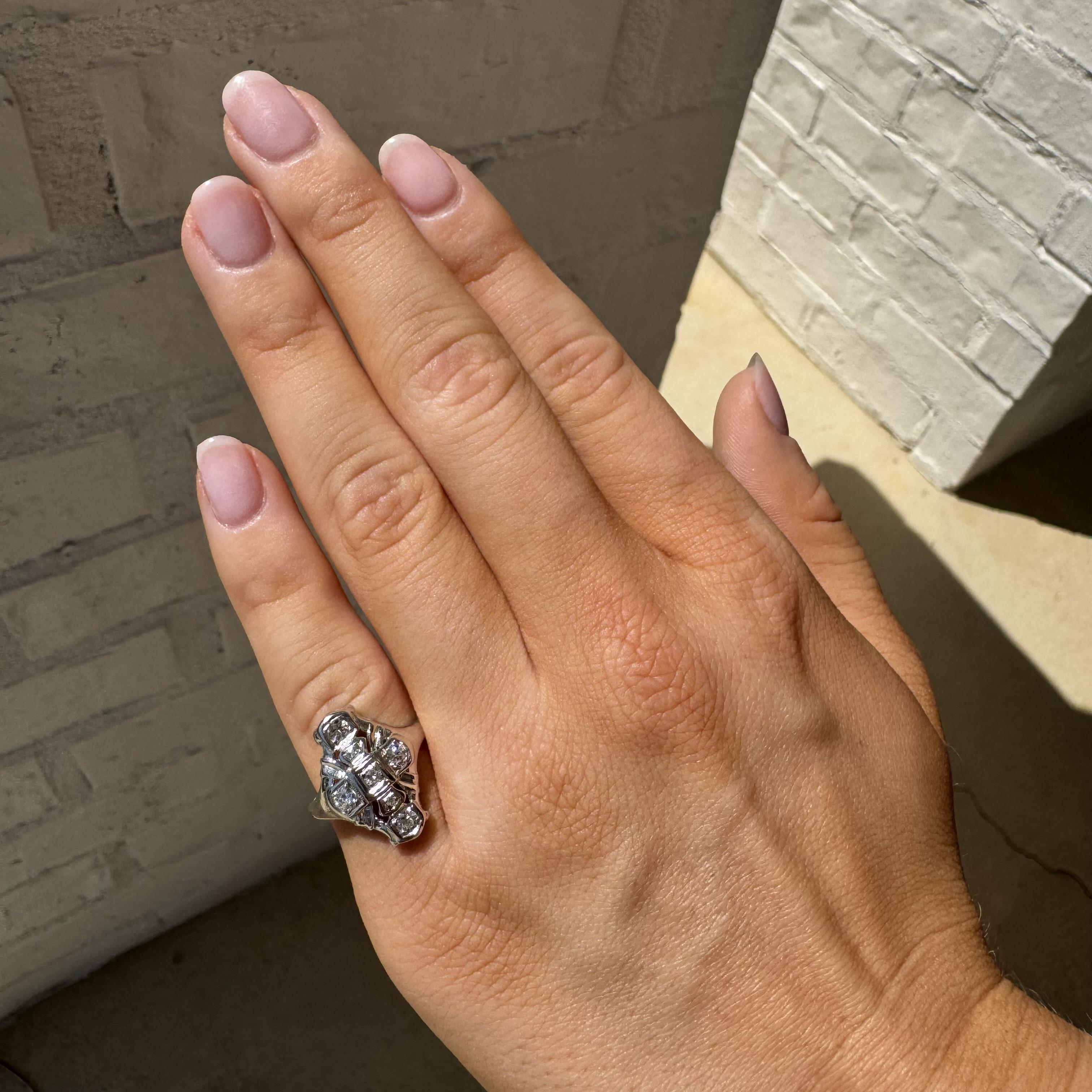 We always love these elongated vintage rings!

Ring Details
Material: 14K White Gold
Era: Art Deco 1920 - 1940
Head Length: 17.6mm
Head Height: 2.8mm
Weight: 2.9 Grams
Finger Size: 4
Sizable Upon Request

Accented by the following gemstones
4 -