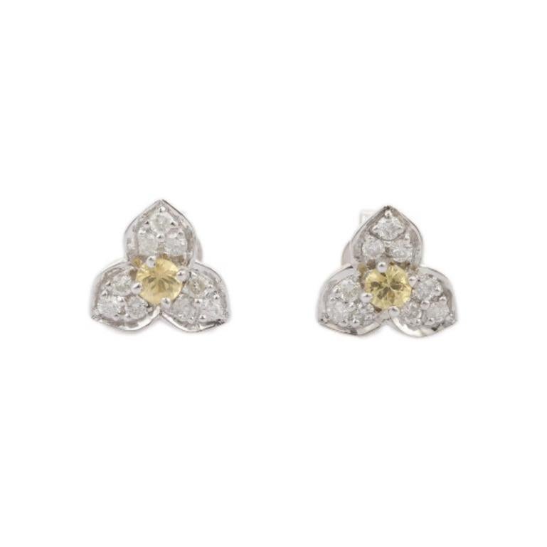 These gorgeous Dainty Yellow Sapphire Diamond Trillium Flower Stud Earrings are crafted from the finest material and adorned with dazzling yellow sapphire which protects against evil energy and bring desired outcomes.
These studs earring are perfect