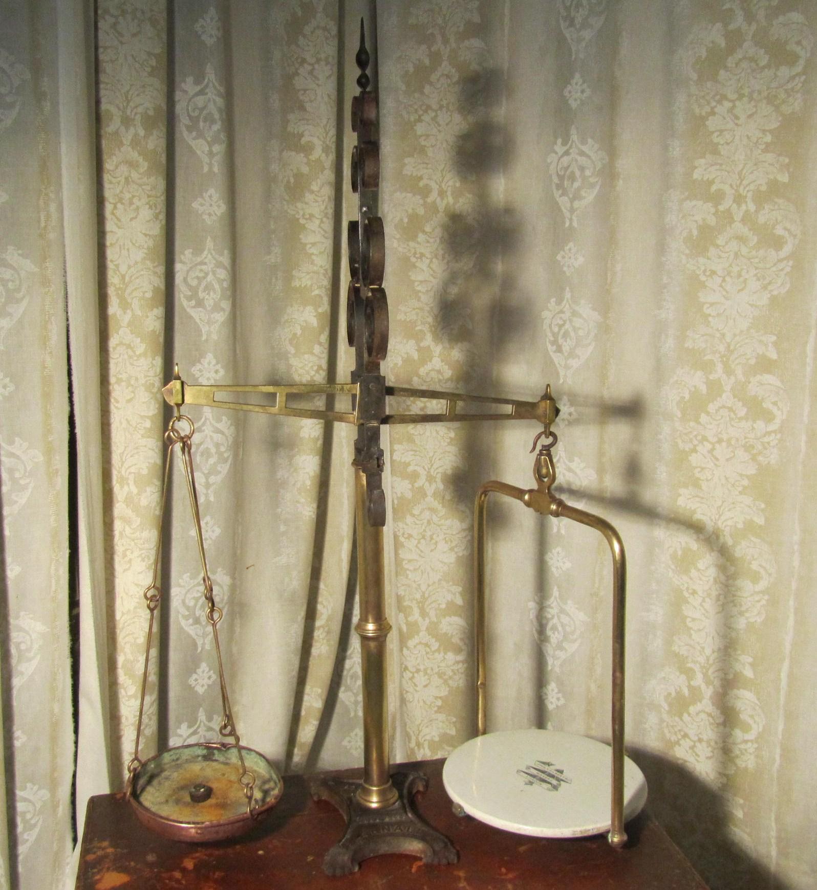 Dairy balance scales by Parnall of Bristol

Superb large brass and iron dairy balance scales by Parnall of Bristol
This very large and attractive beam balance scale is set on a cast Iron base the central upright column is in brass and it is