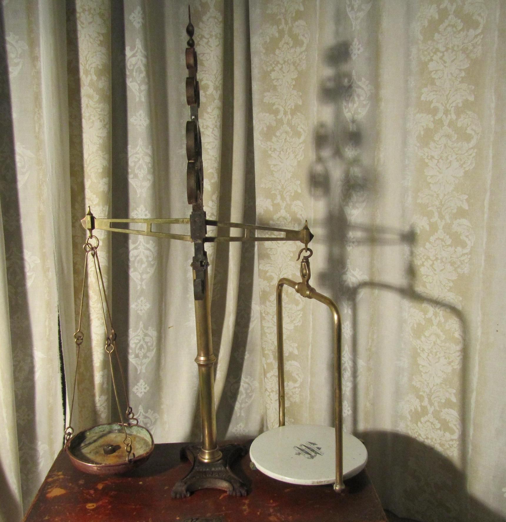 Dairy Balance Scales by  Parnall of Bristol

Superb Large Brass and Iron Dairy Balance Scales by  Parnall of Bristol
This very large and attractive beam balance scale is set on a cast Iron base the central upright column is in brass and it is topped