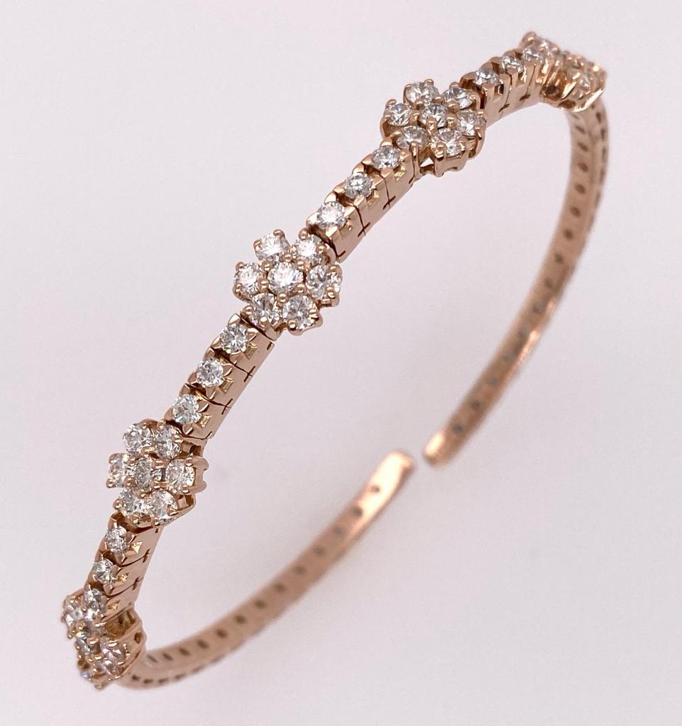 This Daisy bangle has five diamond clusters and consists of forty-nine brilliant round diamonds as a total diamonds of bangle. Women can wear as a fashion jewelry or daily-wear. It is perfect for a gift for your beloved one. 

Diamonds Shape: