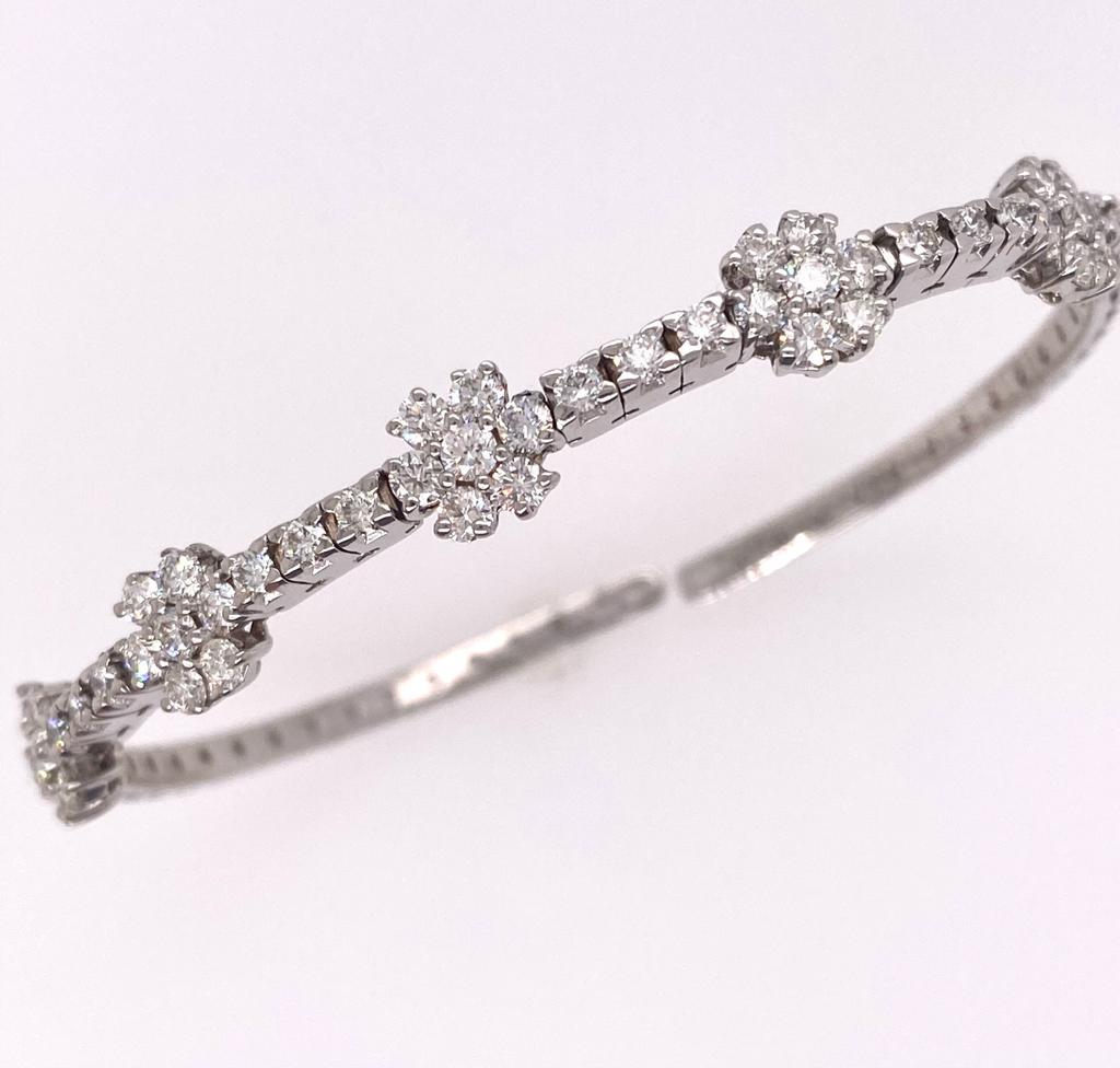 This Daisy bangle has five diamond clusters and consists of forty-nine brilliant round diamonds as a total diamonds of bangle. Women can wear as a fashion jewelry or daily-wear. It is perfect for a gift for your beloved one. 

Diamonds Shape: