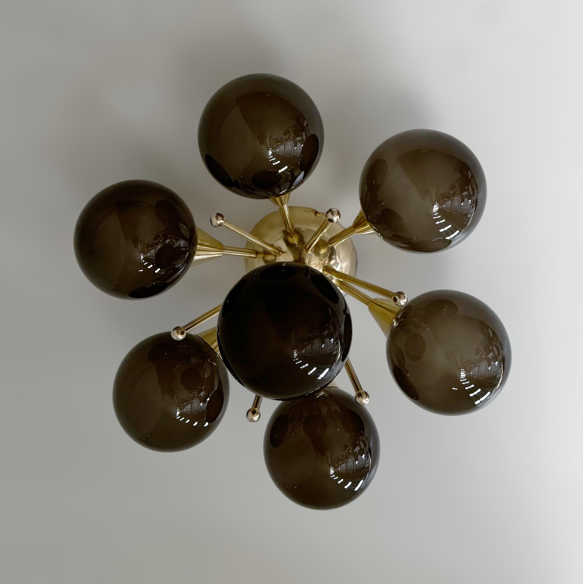Italian flush mount with Murano glass globes mounted on solid brass frame 
Designed by Fabio Bergomi / Made in Italy 
7 lights / E12 or E14 type / max 40W each 
Diameter: 24 inches / Height: 12 inches 
Order only / This item ships from Italy 
Order
