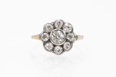Daisy gold and silver ring with old brilliant-cut diamonds.