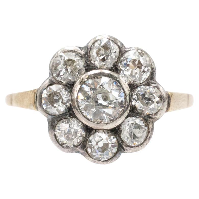 Anello a margherita in oro e argento con vecchi diamanti taglio brillante. in vendita