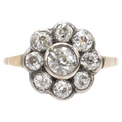 Anello a margherita in oro e argento con vecchi diamanti taglio brillante.