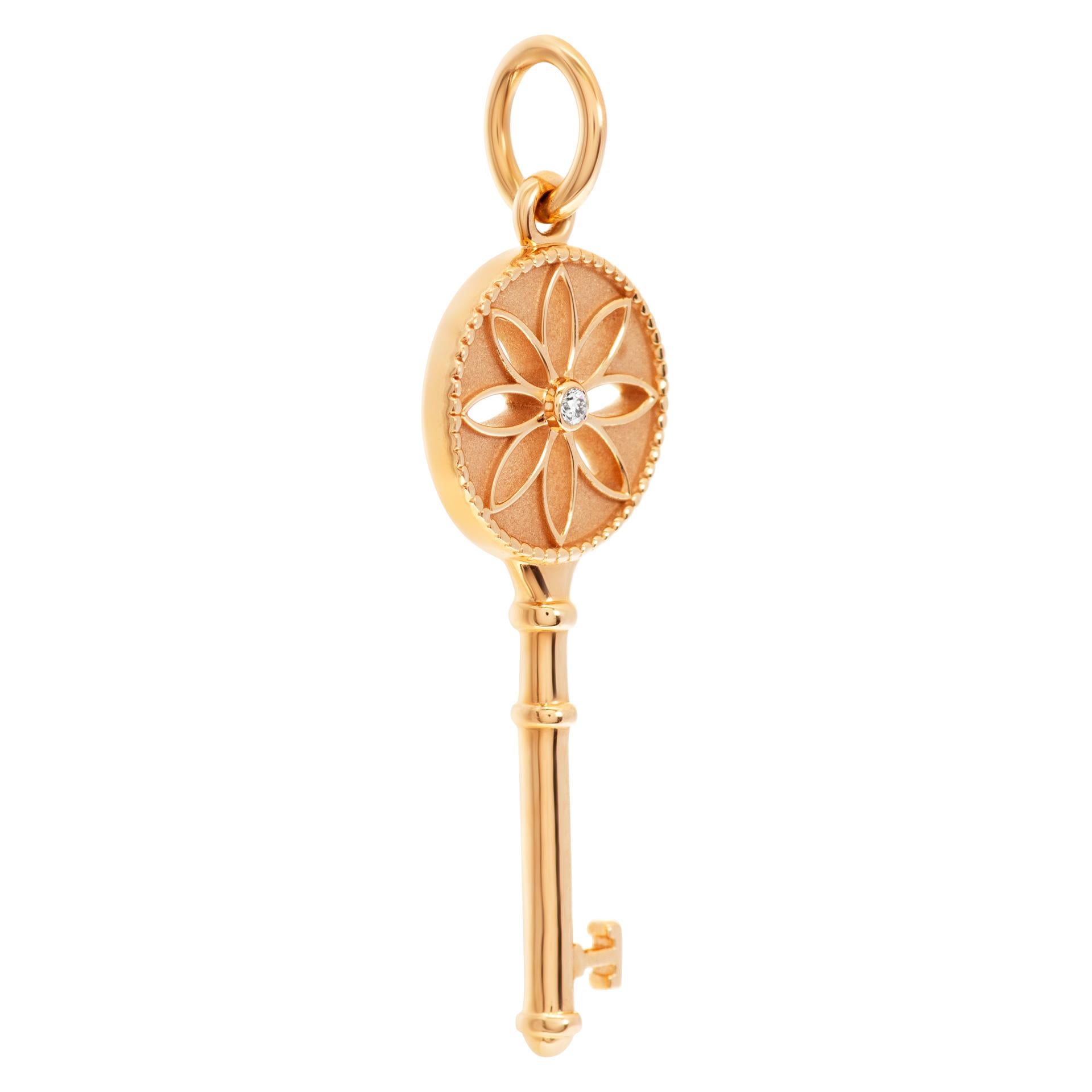 Tiffany & Co. Daisy Key charm in 18k rose gold. With round brilliant diamond accent Length: 38.2mm width: 12mm.
