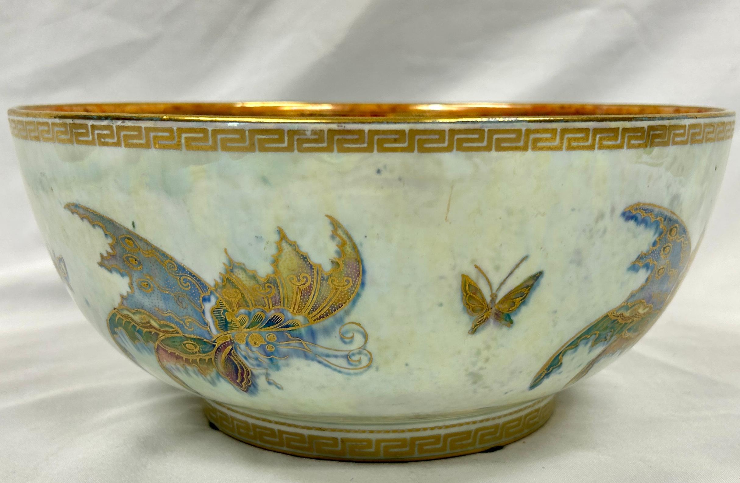 Stunning large English Wedgewood Fairyland Butterfly Lustre Bowl is an example of Daisy Makeig-Jones' unique artistry. The butterfly pattern is Z4832 and issued between 1914 and 1915. Made of porcelain in art nouveau style. Outside is cream color