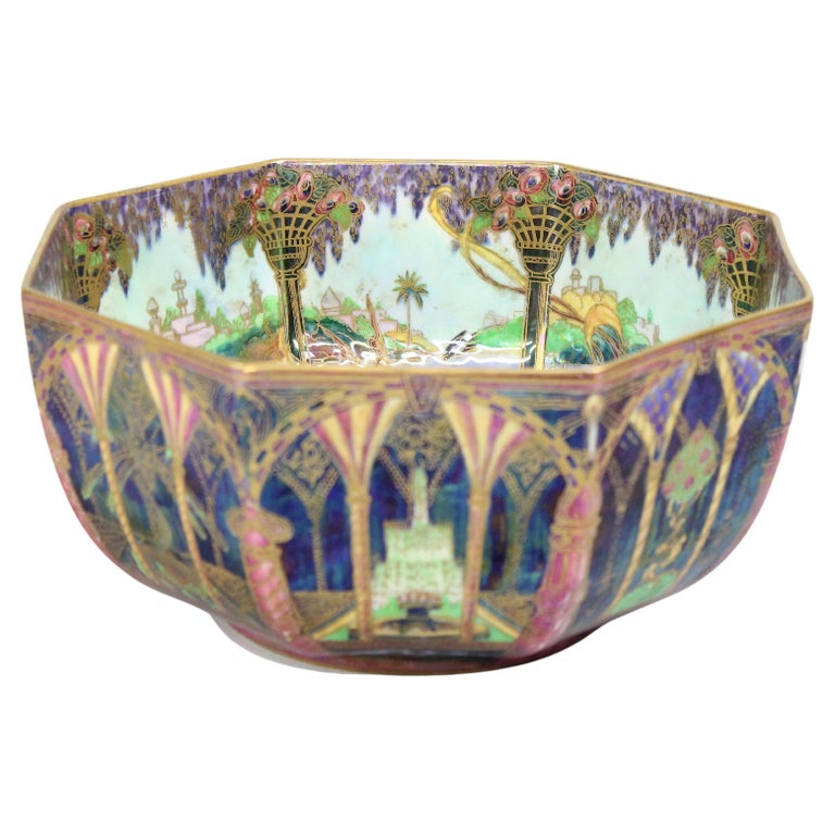 A Wedgwood Fairyland Lustre octagonal-shaped bowl, designed by Daisy Makeig-Jones, the exterior gilt and enamelled with Moorish pattern depicting ornate crimson columns, fountains and ornamental trees against a black ground, the interior with Smoke
