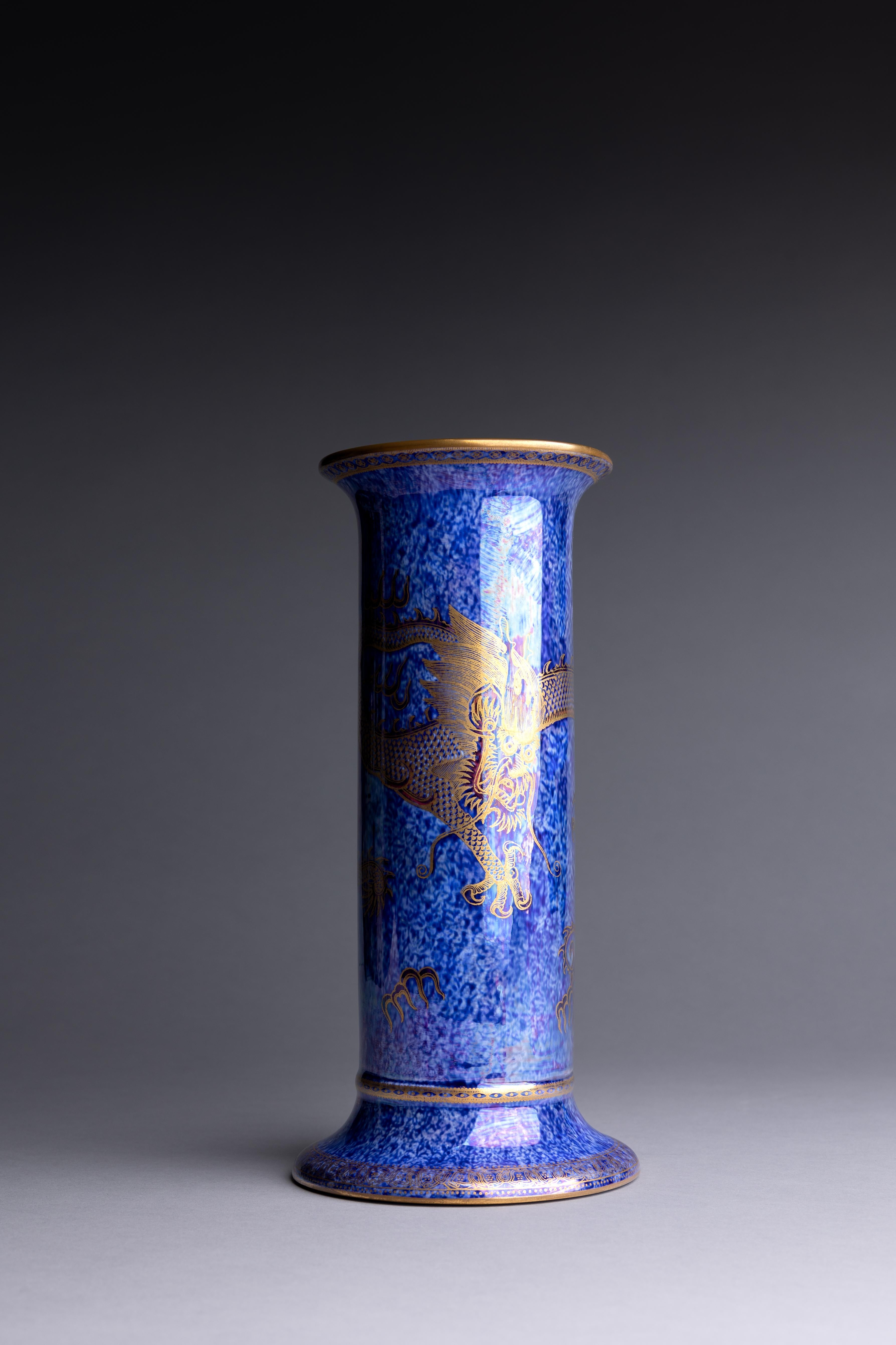 A blue lustre bone china columnar vase with gilded dragon details, designed by Daisy Makeig-Jones of the Wedgwood factory circa 1920.

Like many Western artists before her, Wedgwood designer Daisy Makeig-Jones was drawn to the arts and design of the