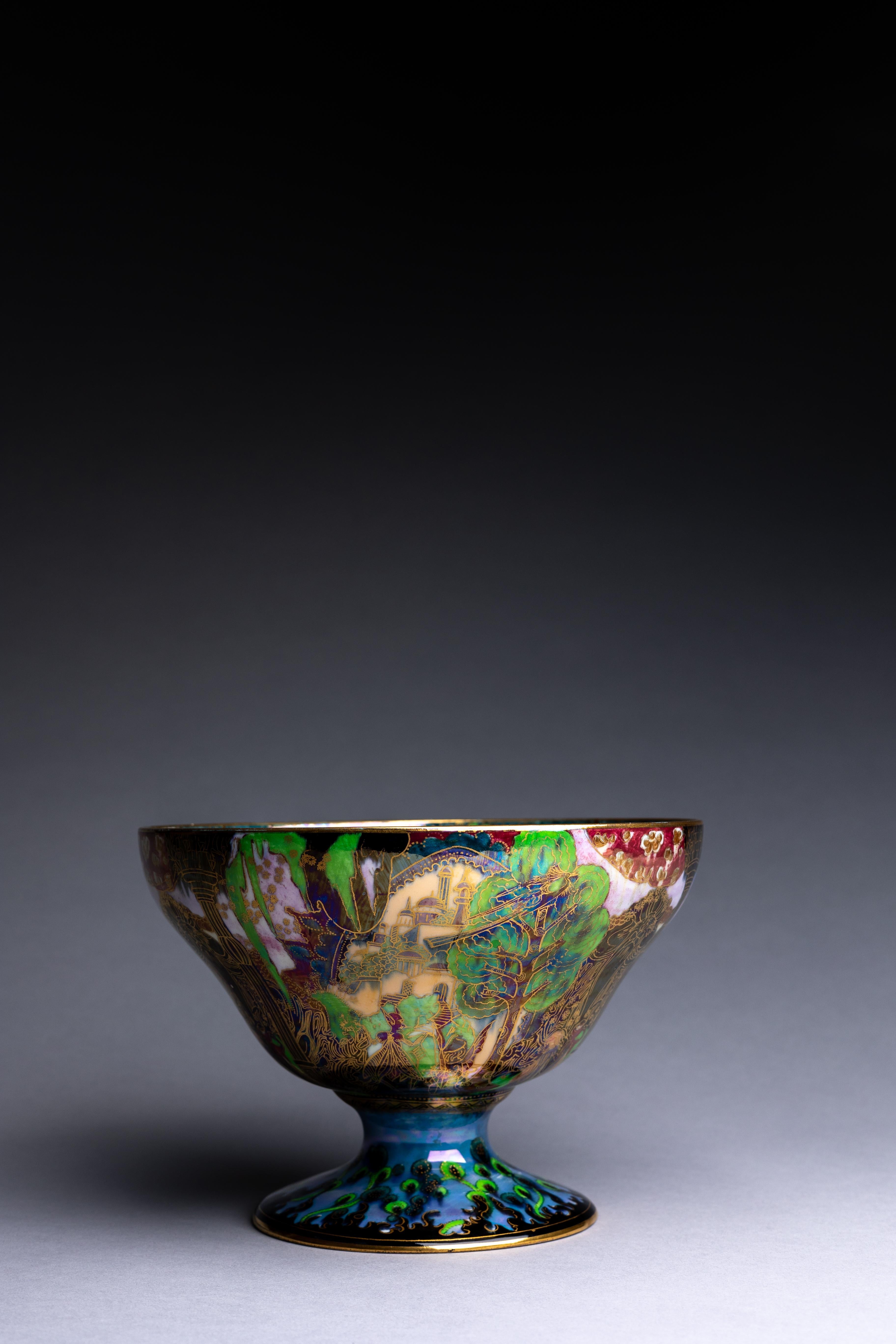 A Wedgwood Fairyland lustre bowl designed by Daisy Makeig-Jones ca. 1920 and decorated with the 'Garden of Paradise' pattern on the exterior and the 'Jumping Faun' pattern on the interior.

Daisy Makeig-Jones is best known for the Fairyland Lustre