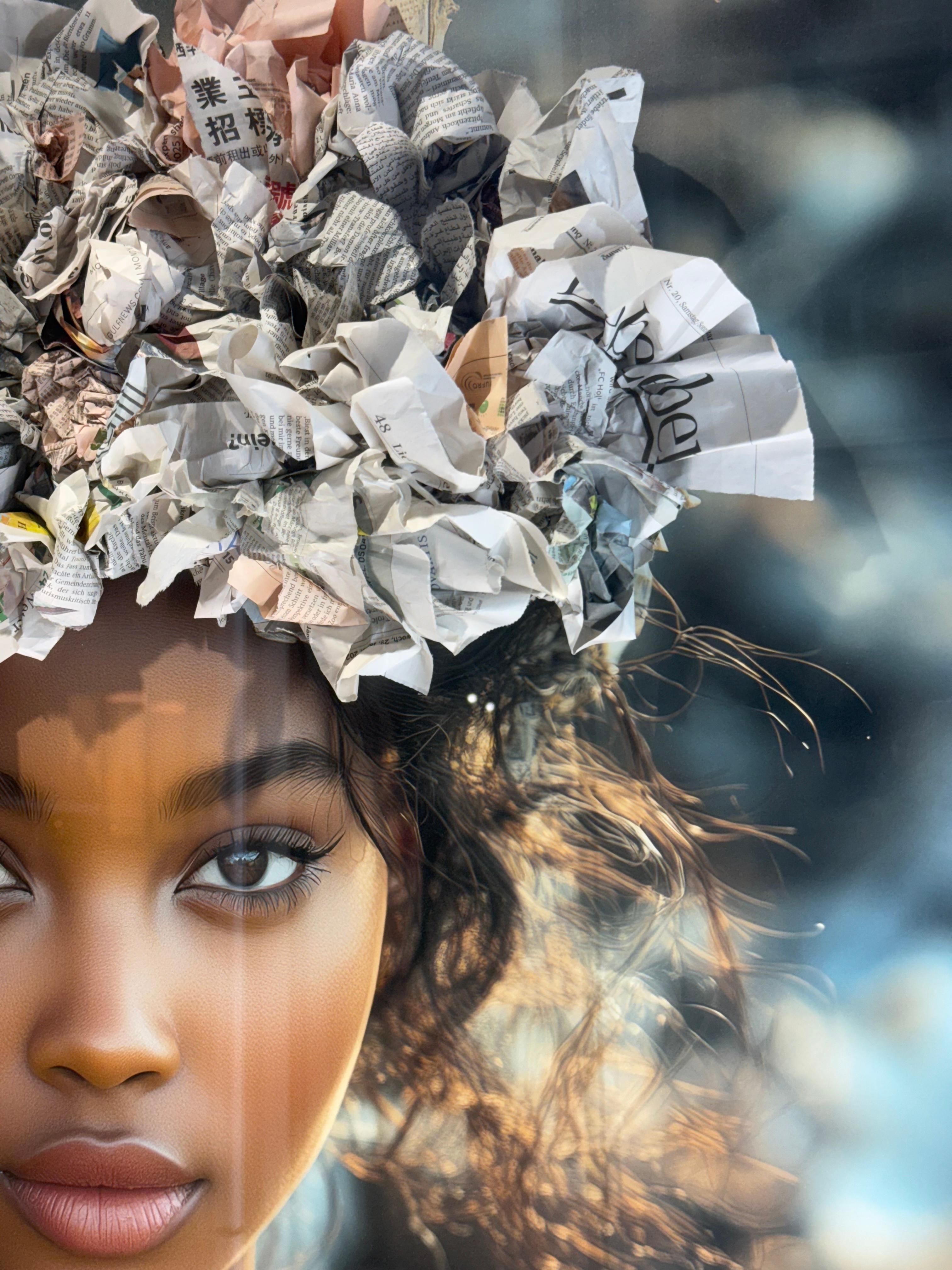 Garbage Queen is a striking mixed-media series that blends photography with physical waste — discarded plastics, newspapers, and other salvaged debris — assembled into sculptural garments and affixed to the surface of each print. The images are