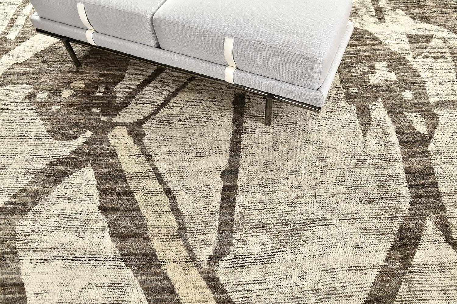 Dakhala' is a beautifully textured rug with irregular motifs inspired from the Atlas Mountains of Morocco. Earth-toned colored shag and hints of colorwork cohesively make for a great contemporary interpretation for the modern design world.