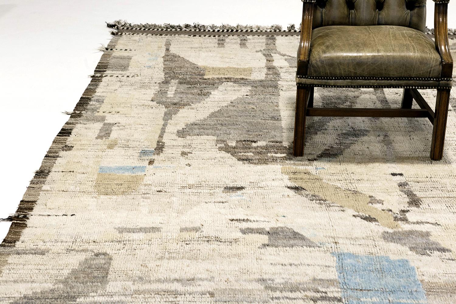 'Dakhla' is a beautifully textured rug with irregular motifs inspired from the Atlas Mountains of Morocco. Earth toned colored shag and hints of color work cohesively to make for a great contemporary interpretation for the modern design world.