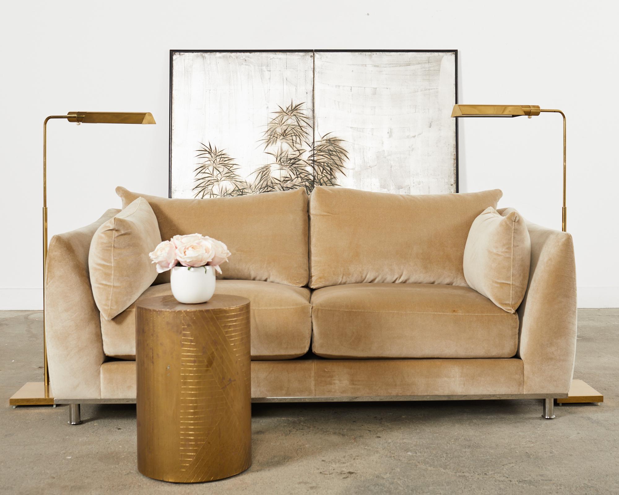 Bespoke camel mohair sofa settee designed by Dakota Jackson. The Iko Downs sofa features a hardwood frame mounted to a polished stainless steel base with tubular legs. Custom ordered in an COM soft mohair upholstery fabric in a stylish camel tone.