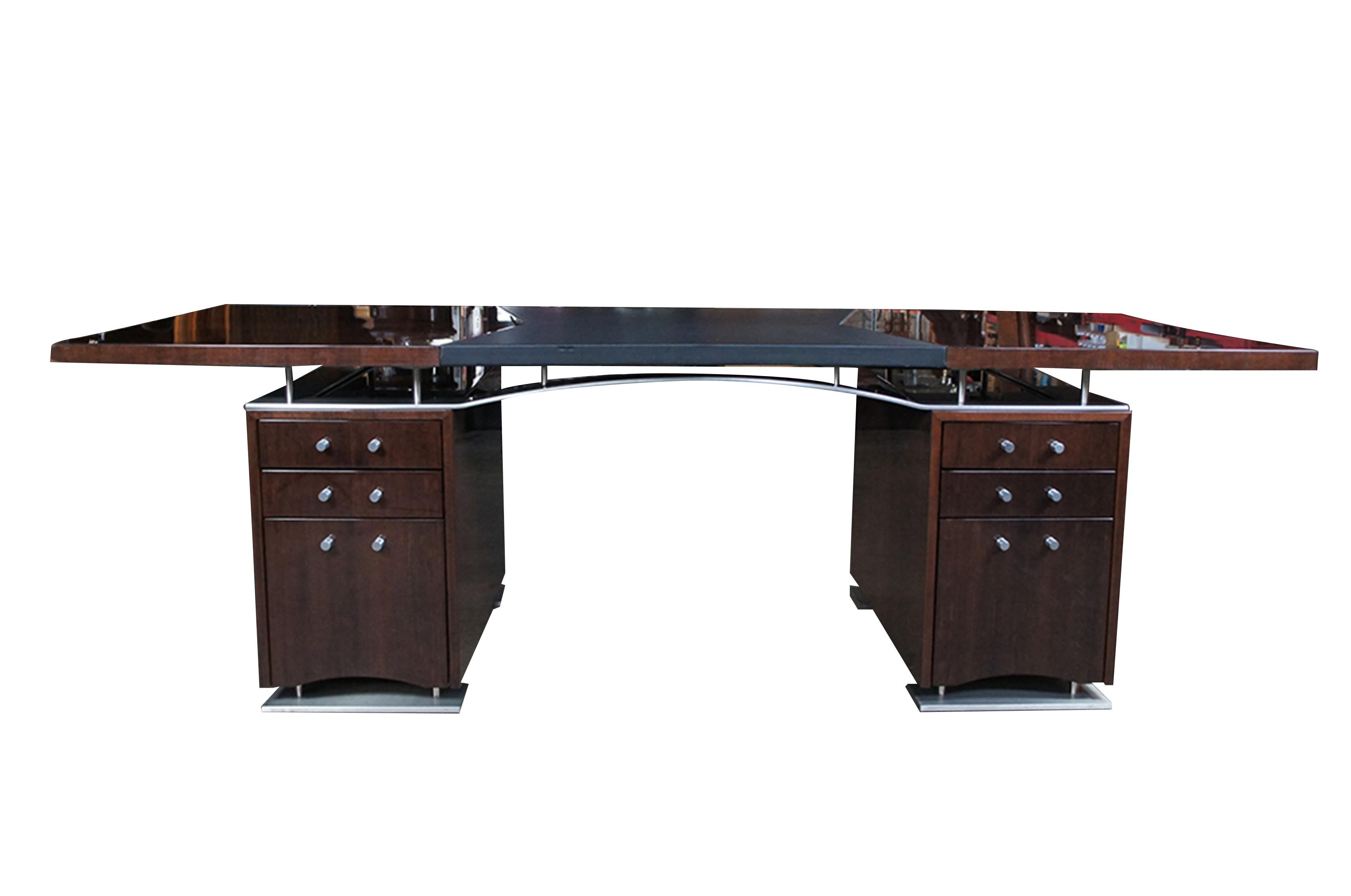 Vintage Dakota Jackson post modern Art Deco style executive partners desk featuring mahogany with leather insert and stainless steel frame.  A V-Shape pattern veneer top with Black Leather inset. 2 pedestal cabinets below: each with 2 standard